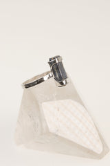 Raw Australian Ocean Kyanite ring displayed on clear quartz, with oxidized sterling silver setting and deep blue crystal.
