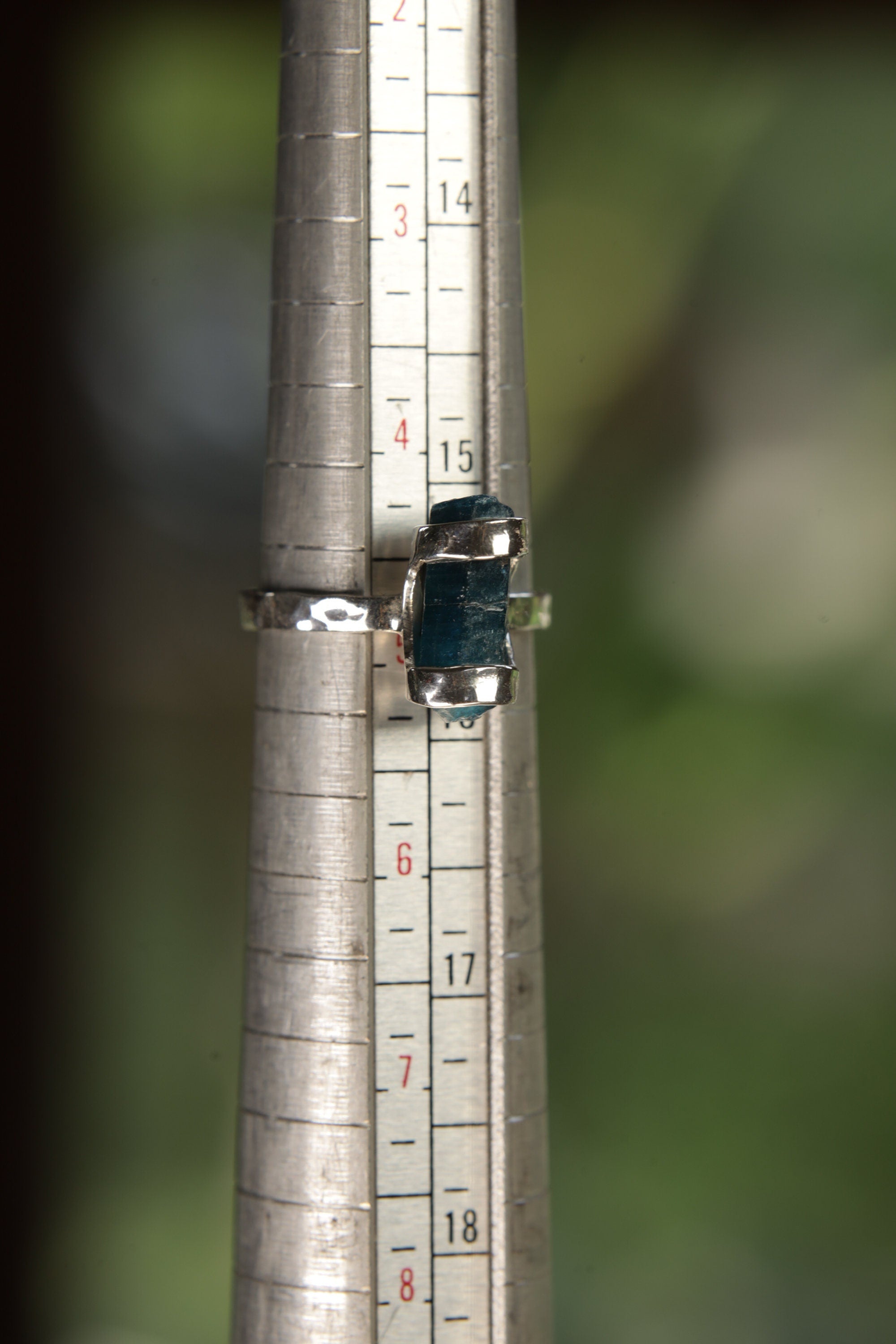 Terminated Blue Apatite ring shown on a ring mandrel for sizing, appearing around US size 5 to 5.5.
