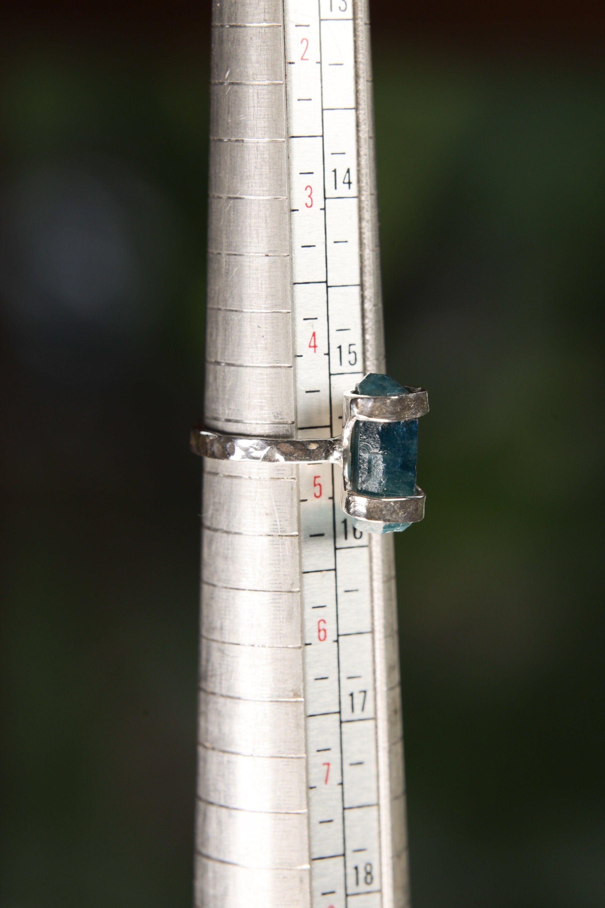 Blue Apatite sterling silver ring shown on a mandrel for size reference, appearing around US size 5.