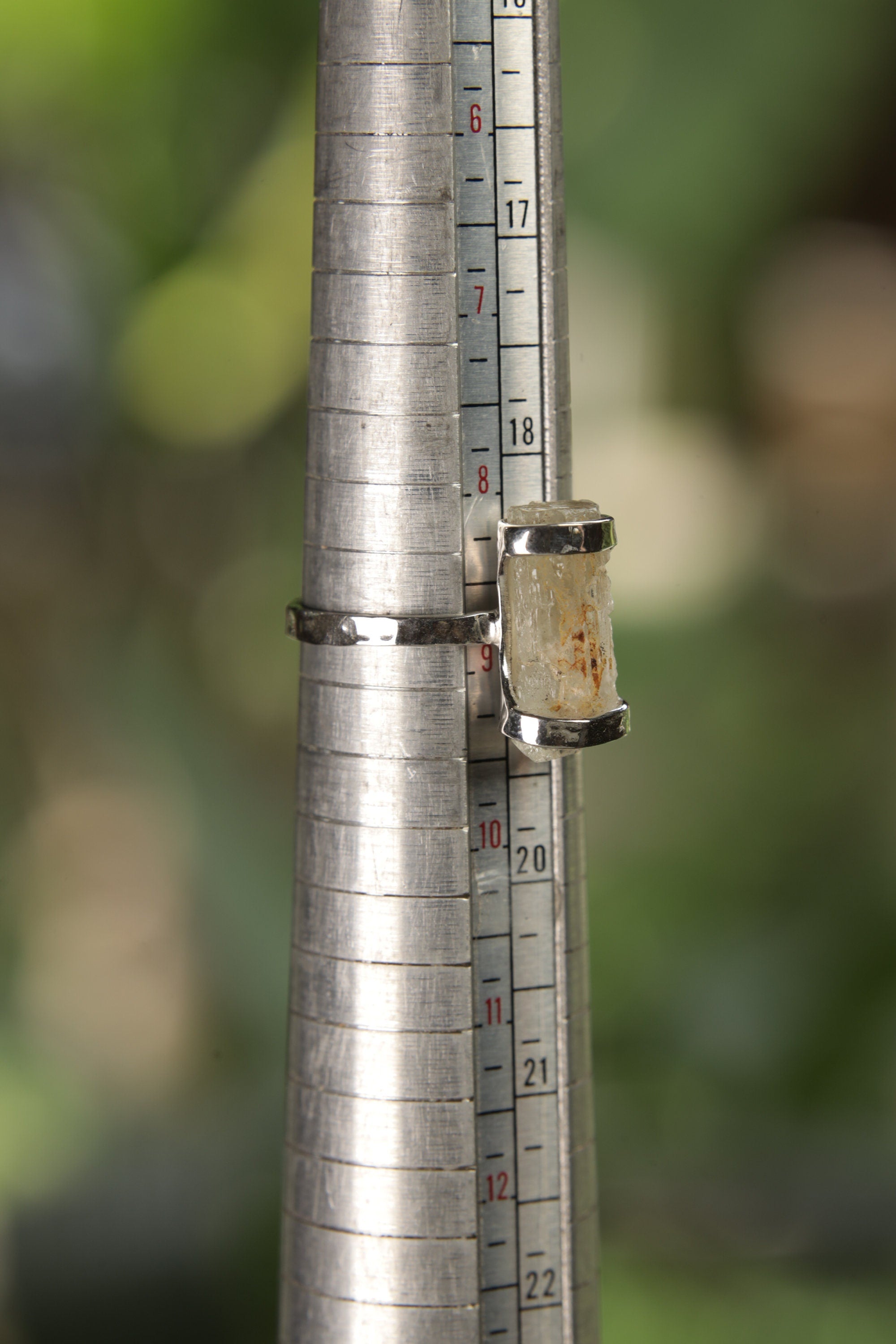 Raw Australian Aquamarine sterling silver ring shown on a mandrel for size reference, appearing around US size 8.5 to 9.