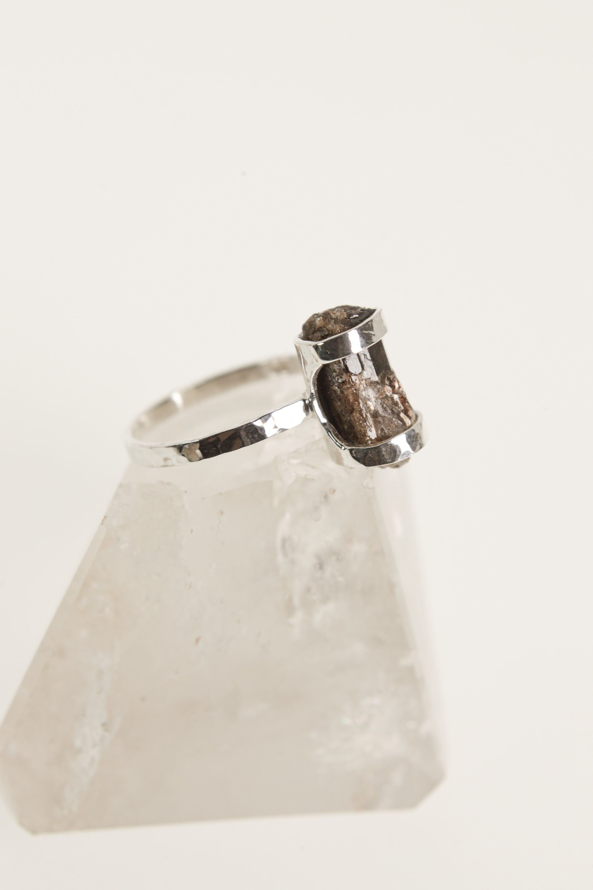 Side view of Dravite Tourmaline ring showing the raised brown gemstone, oxidized silver setting, and hammered band.