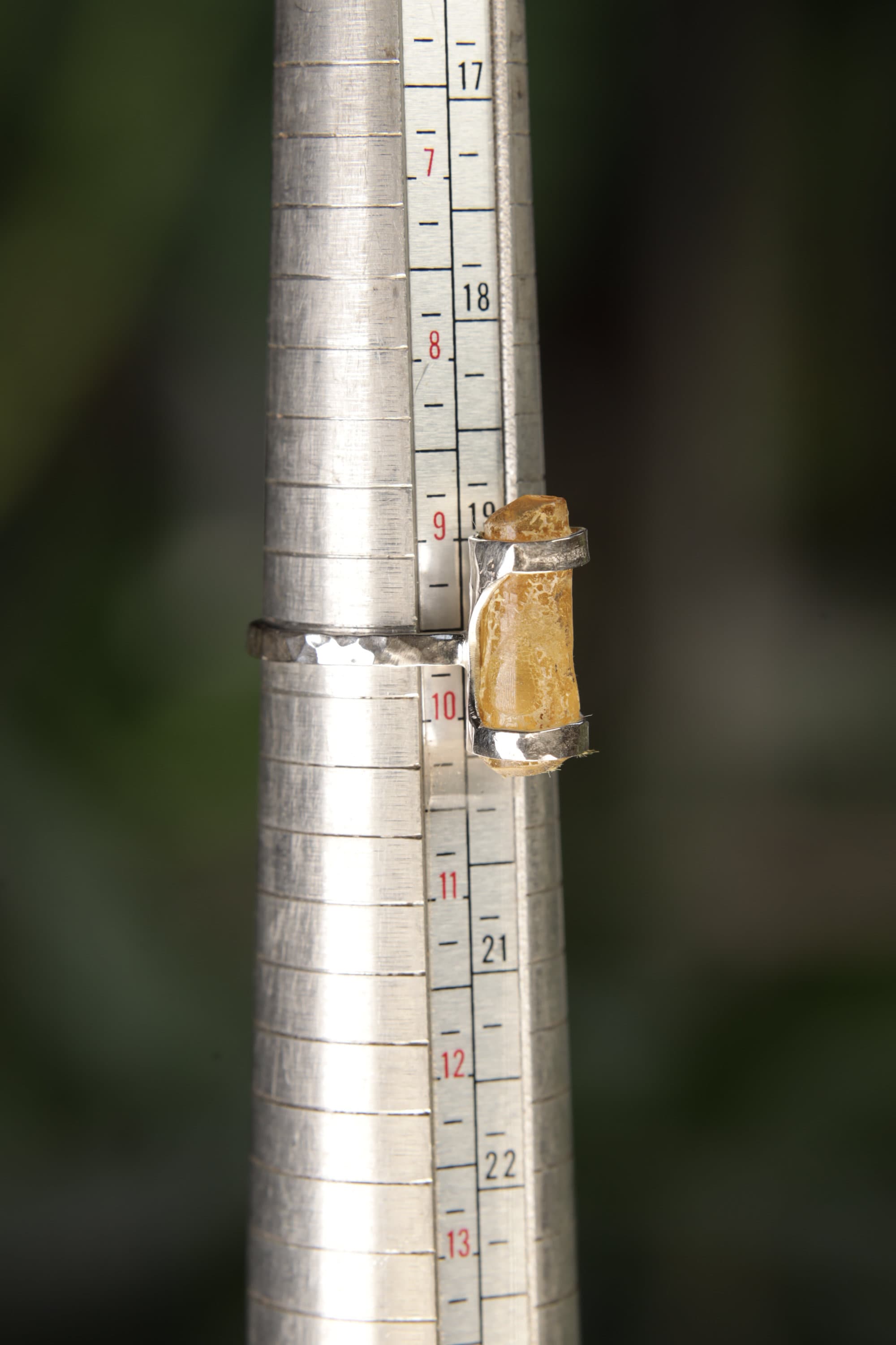 Natural Amber sterling silver ring shown on a mandrel for size reference, appearing around US size 9.5 to 10.