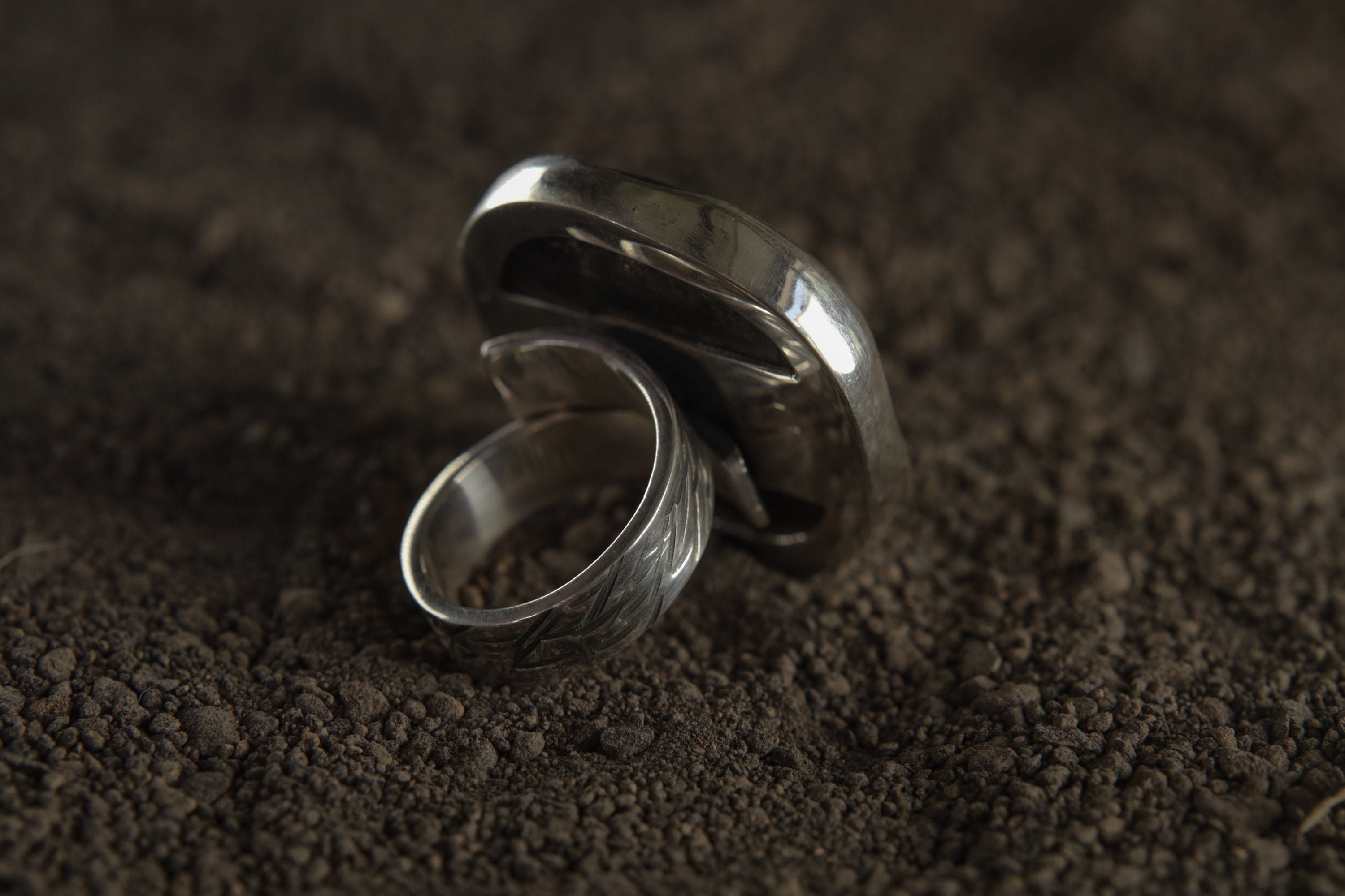 Back view of Pyrite ring showing adjustable sterling silver band and carved-out support plate beneath the stone.