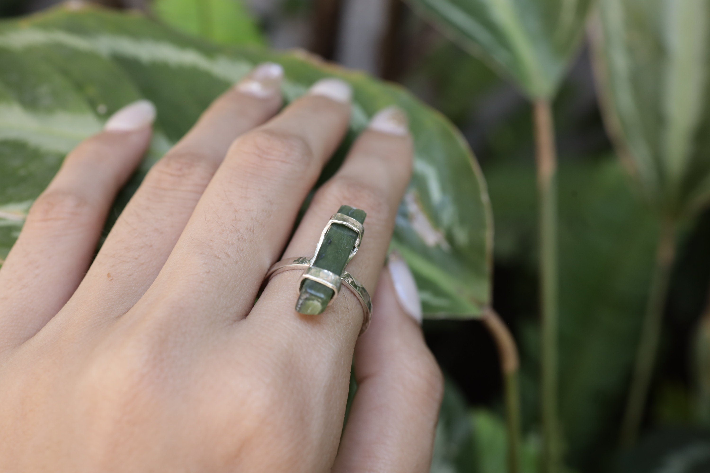 Australian Jade ring shown worn on the hand as a green Heart Chakra gemstone ring in oxidized sterling silver.