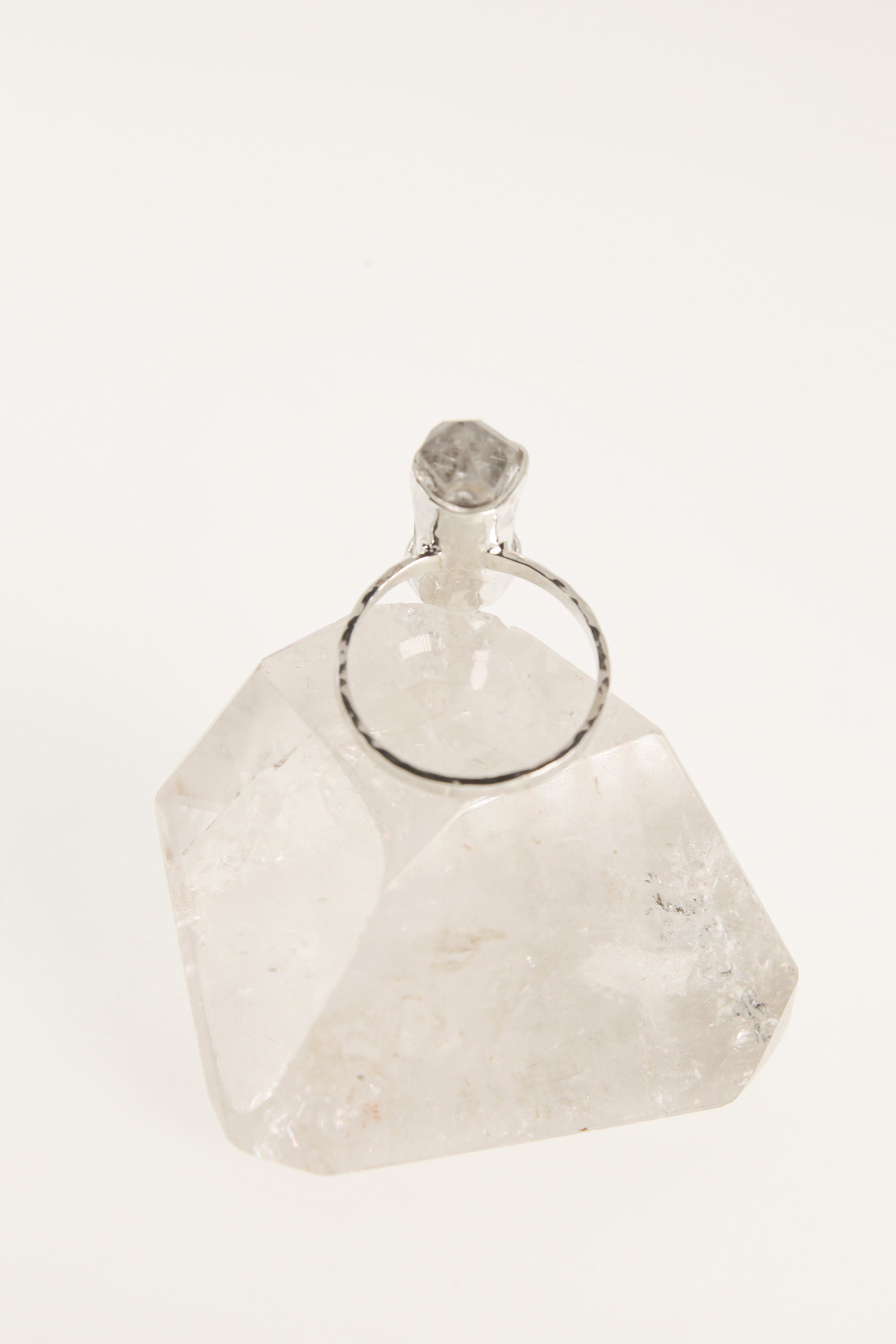 Side view of oxidized sterling silver Tibetan Quartz ring with double terminated crystal and strong handmade silver setting.
