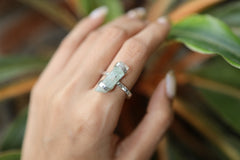 Handmade oxidized 925 sterling silver Australian Aquamarine ring shown worn on the hand, with a soft blue beryl gemstone.