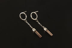 Handmade 925 sterling silver Pink Tourmaline chain earrings shown on the ear, with hammered round studs and raw crystal dangles.