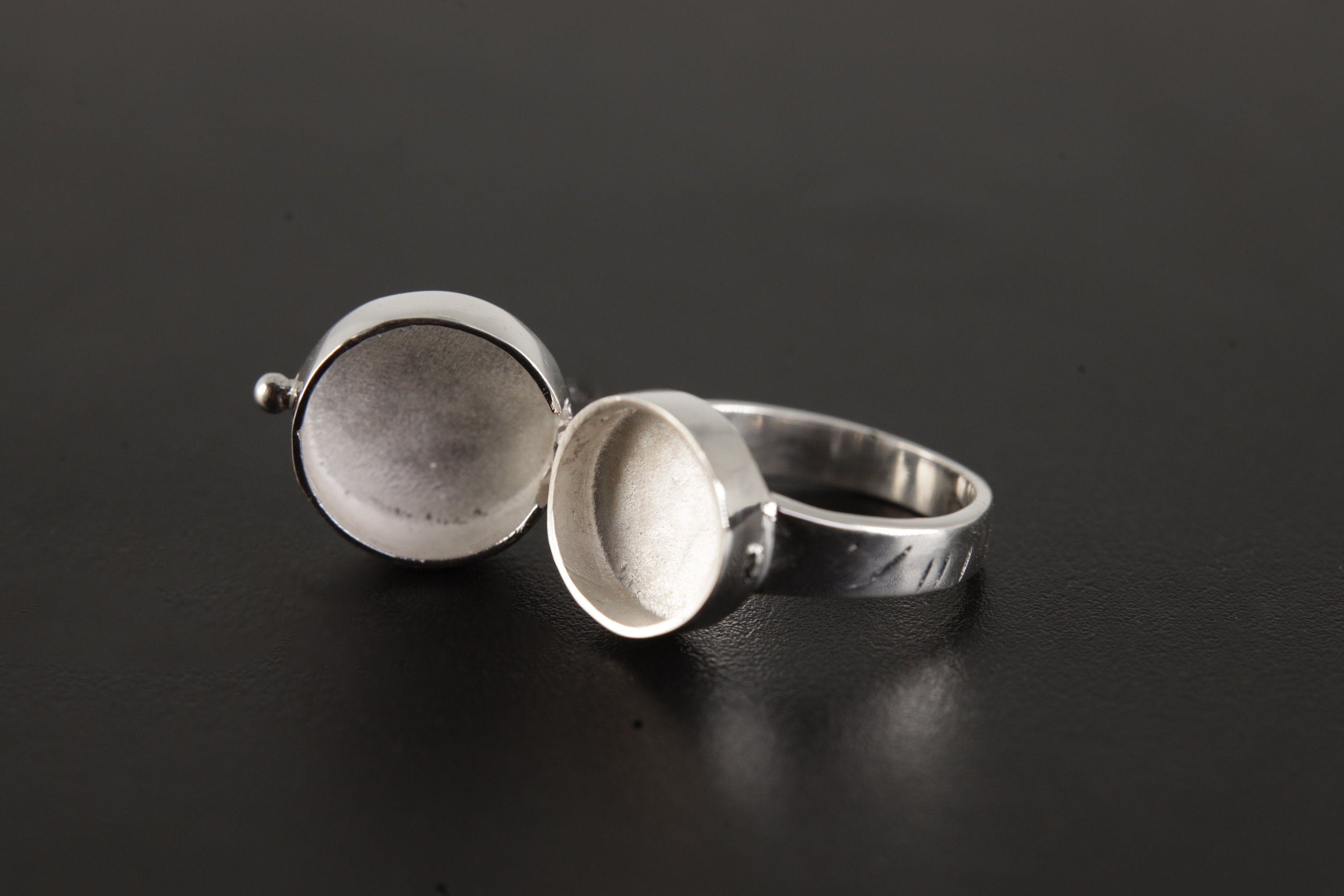Opal Box Ring shown from the front with opening sterling silver compartment