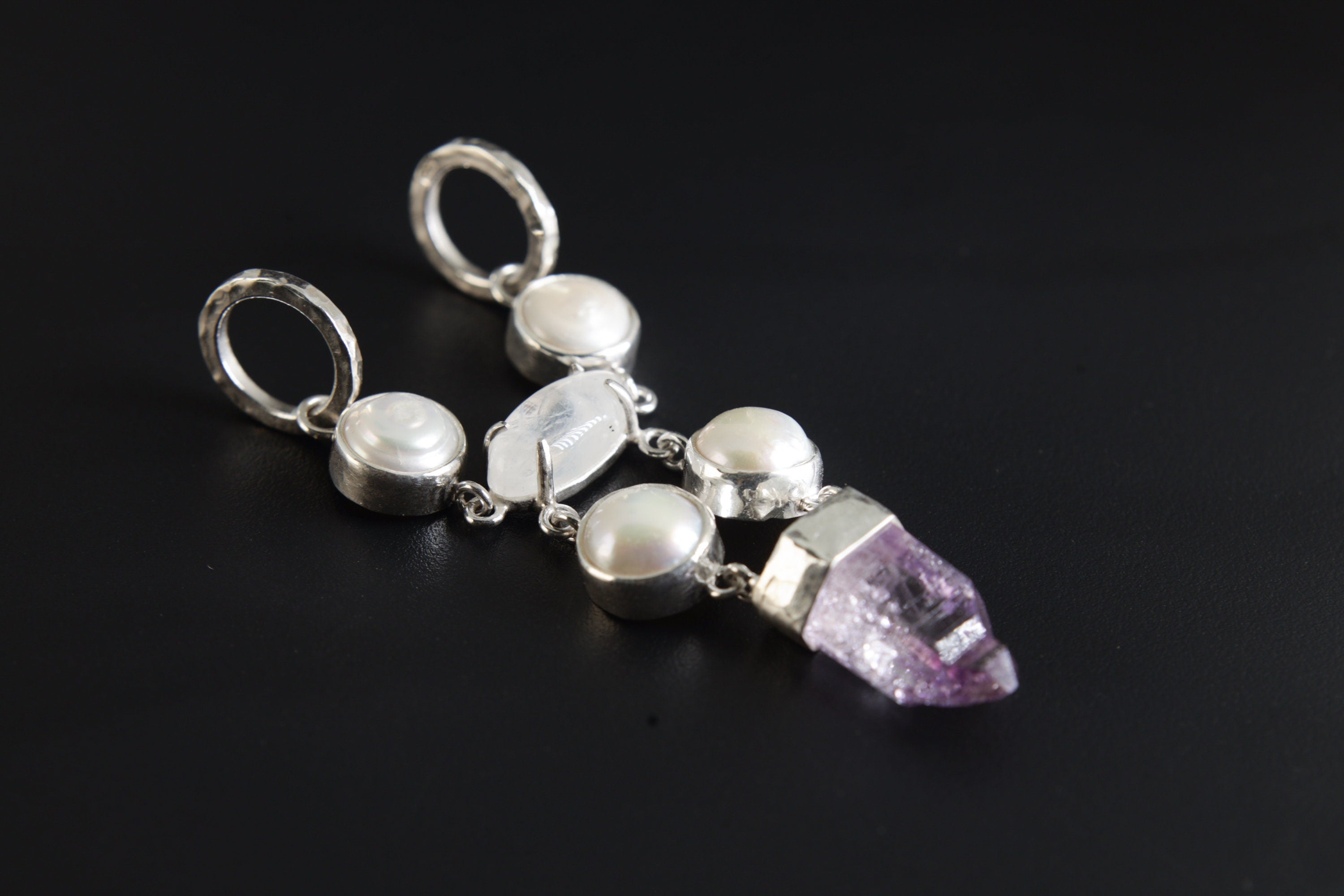South Sea Pearl Moonstone Vera Cruz Amethyst pendant shown on a dark background with high-shine sterling silver settings.