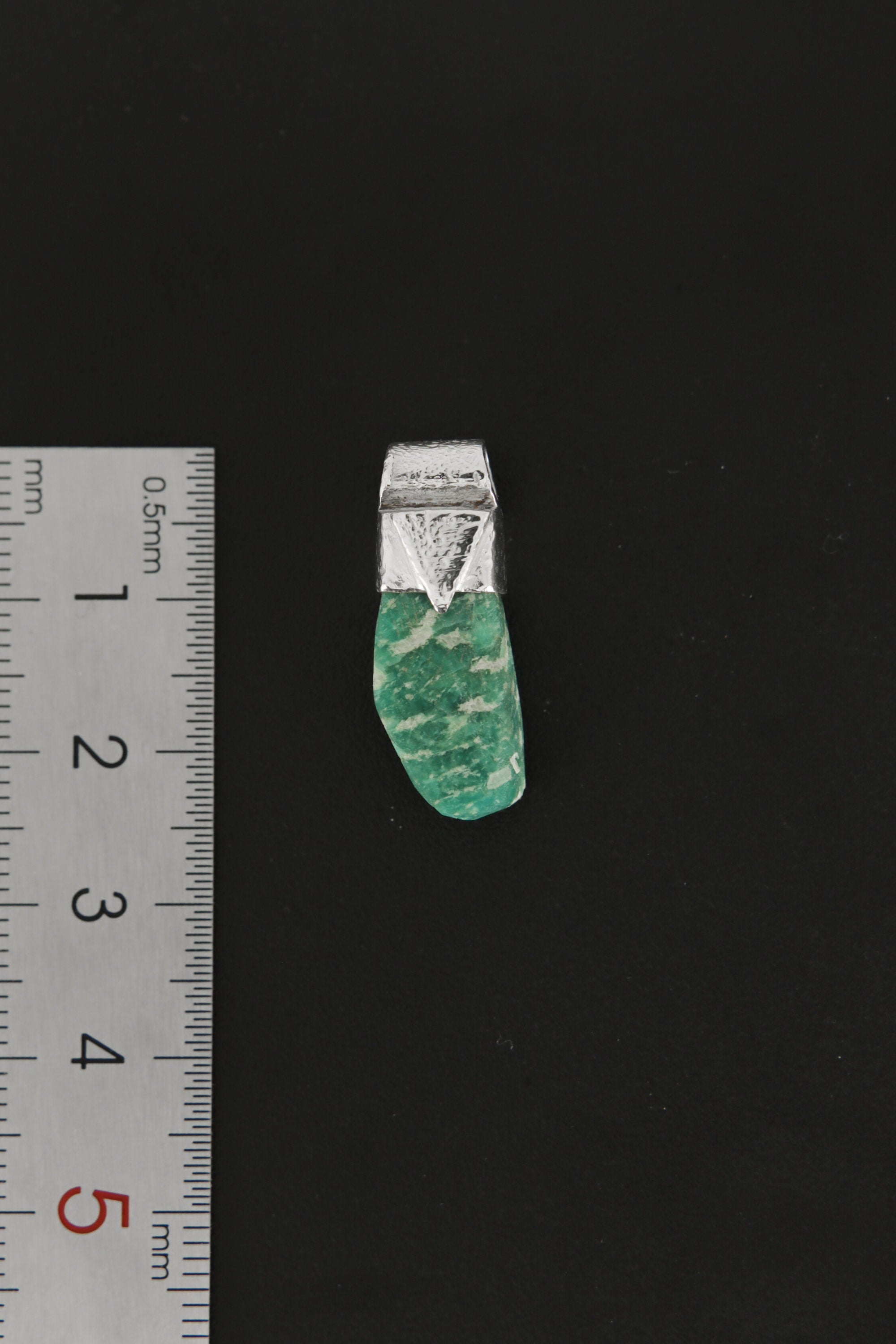 Rough Cut Amazonite Stack Pendant shown beside a ruler for scale with 925 silver cap and blue-green stone.