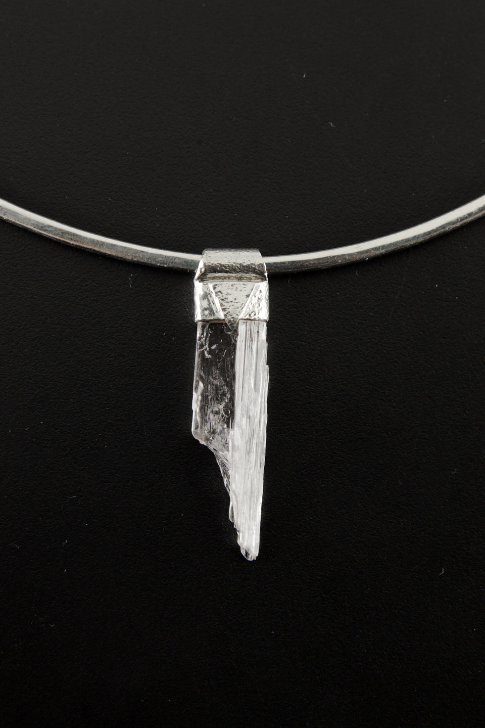 Pink Kunzite Stack Pendant shown on black background with textured sterling silver cap and adjustable necklace.