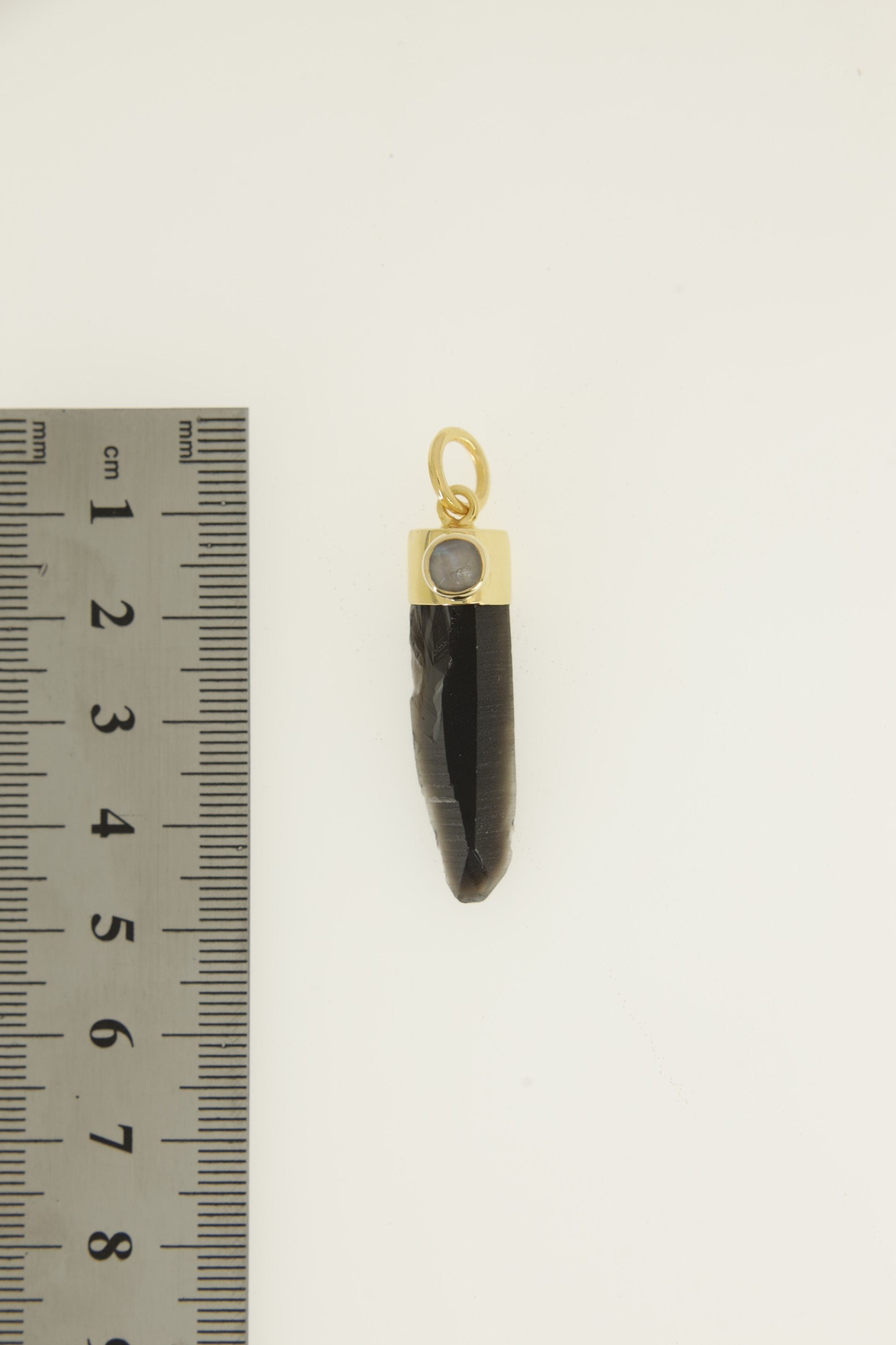 Smoky Phantom Quartz Blue Moonstone pendant shown beside a ruler for scale with 7 mm circular bail and gold-plated cap.