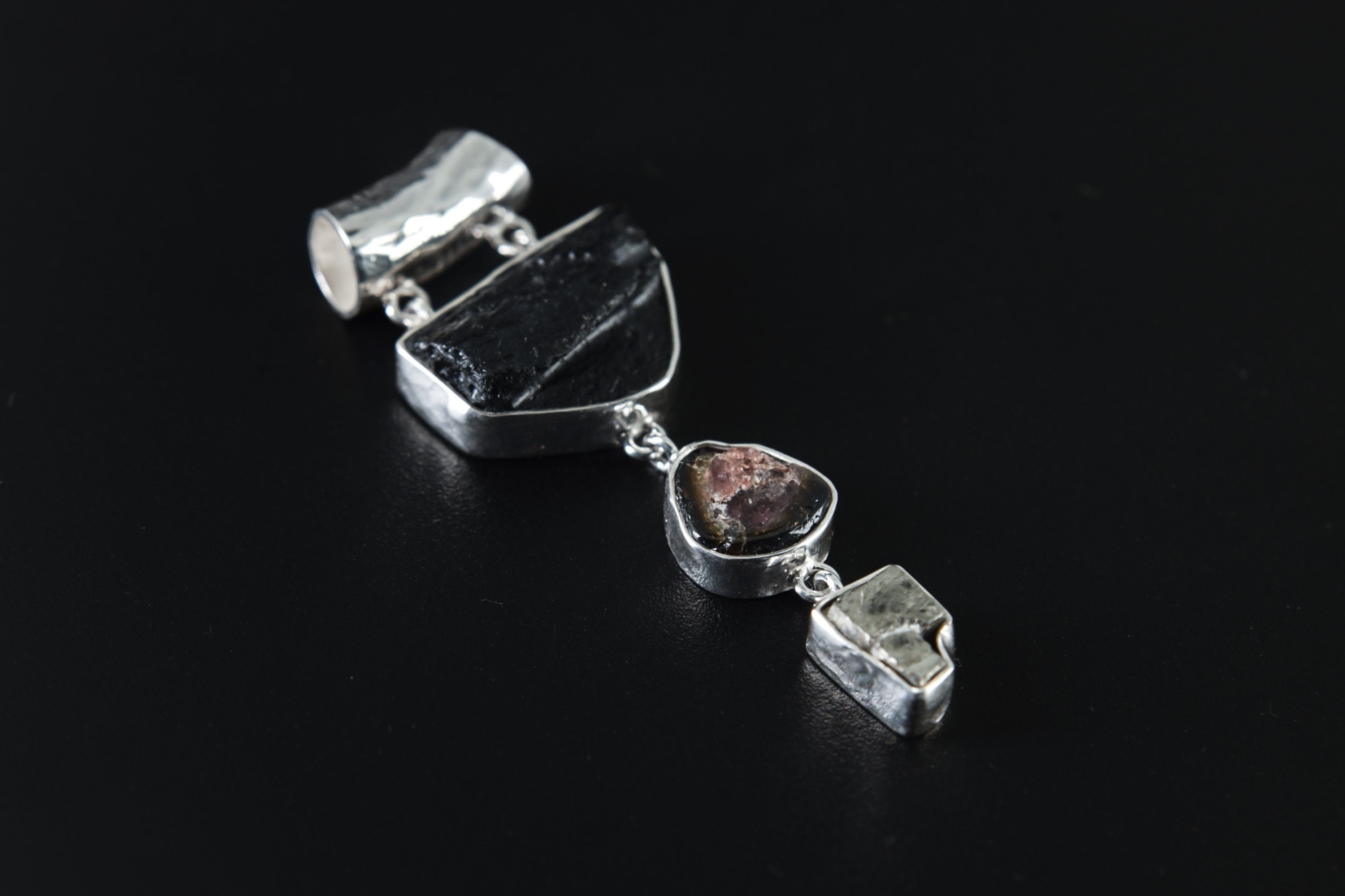 Mount Darwin Tektite Watermelon Tourmaline Pyrite pendant shown on a white background with high-shine 925 sterling silver setting.