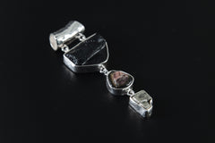 Mount Darwin Tektite Watermelon Tourmaline Pyrite pendant shown on a white background with high-shine 925 sterling silver setting.