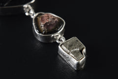 Close-up of raw Mount Darwin Tektite, Watermelon Tourmaline, and Cubic Pyrite in three separate sterling silver bezel settings.