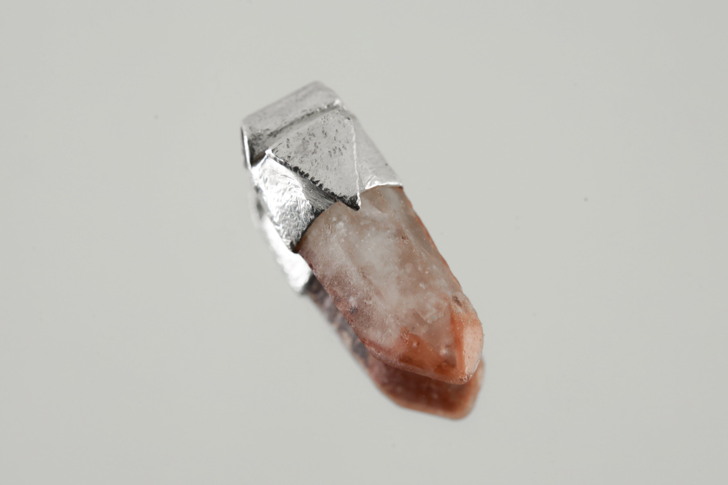 Australian Phantom Lithium Quartz Stack Pendant shown on light background with sterling silver cap and soft pink smoky crystal point.