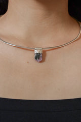 Ruby Black Mica Stack Pendant shown worn on the chest as a small sterling silver layering necklace.
