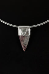 Fang Shaped Charoite Stack Pendant shown on black background with silver choker and purple cabochon body.