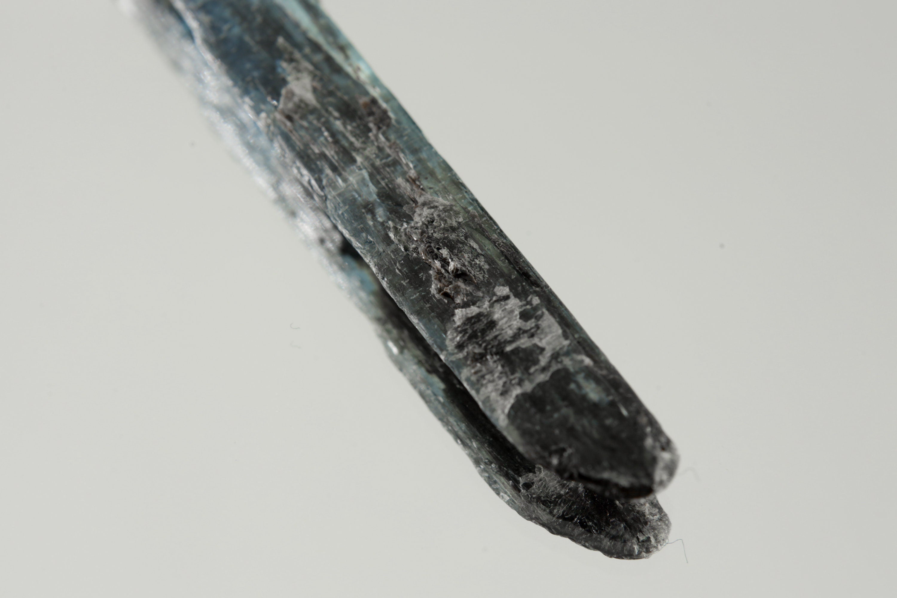 Close-up of Australian Ocean Kyanite in a handmade sterling silver Stack Pendant cap with signature triangle detail.