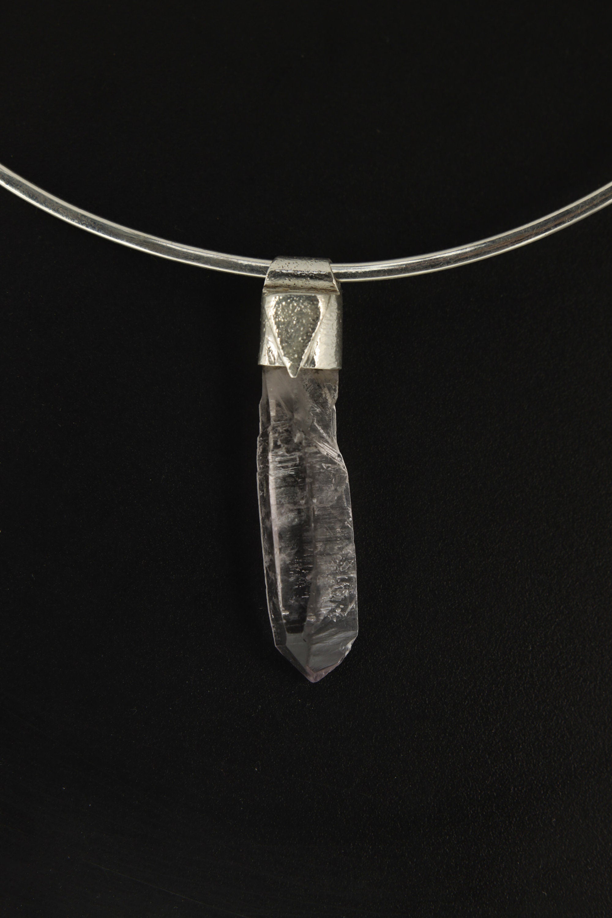 Anhydro Lemurian Vera Cruz Amethyst Stack Pendant shown on black background with silver choker and slender crystal form.