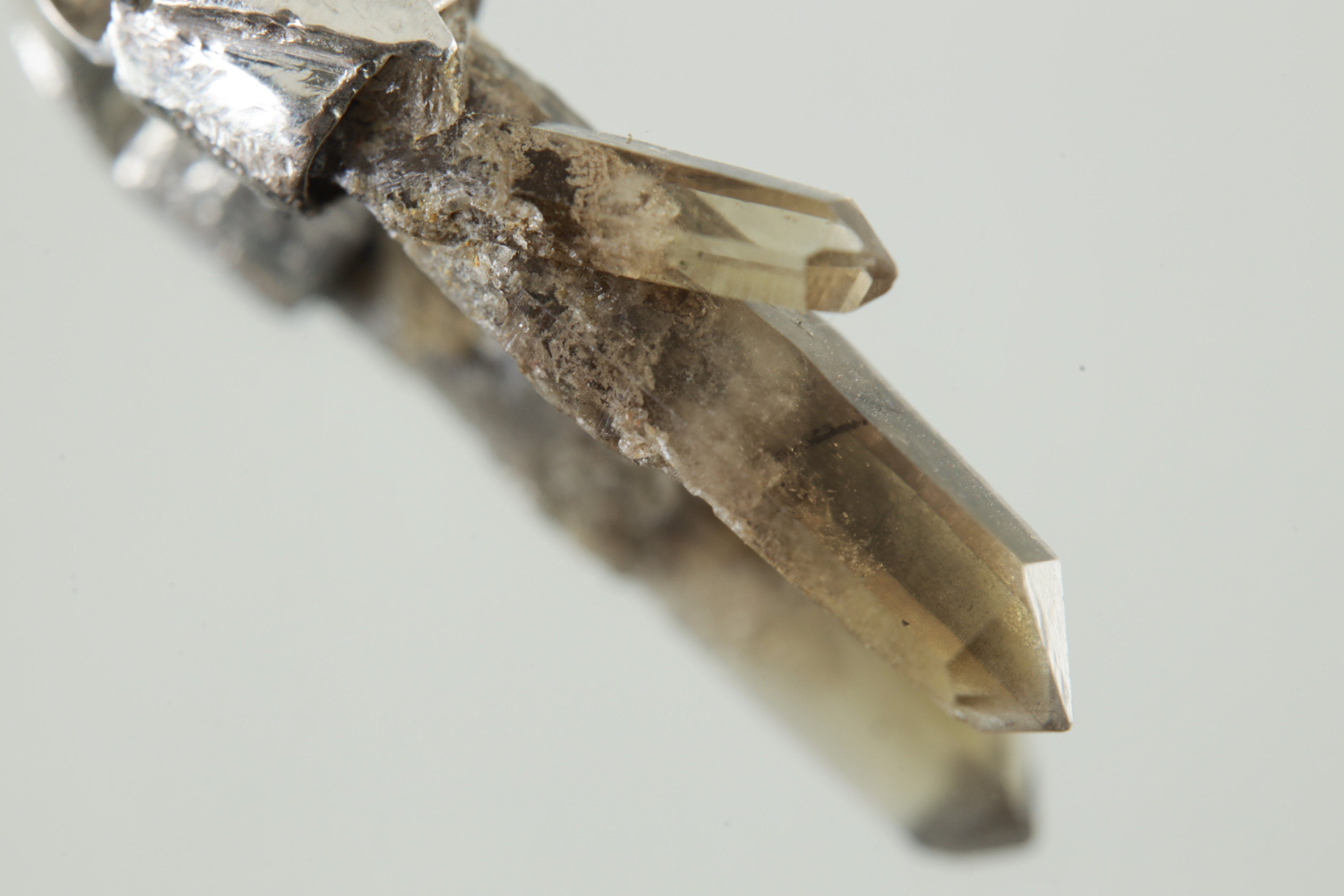 Close-up of Torrington Cathedral Twin Phantom Laser Citrine Quartz showing natural crystal point and warm smoky-golden inclusions.