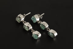 Handmade 925 sterling silver Blue Apatite geometric drop earrings shown on a dark background, with square and triangle gemstone shapes.