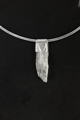 Hiddenite Stack Pendant shown on black background with sterling silver cap and pale green Spodumene crystal.