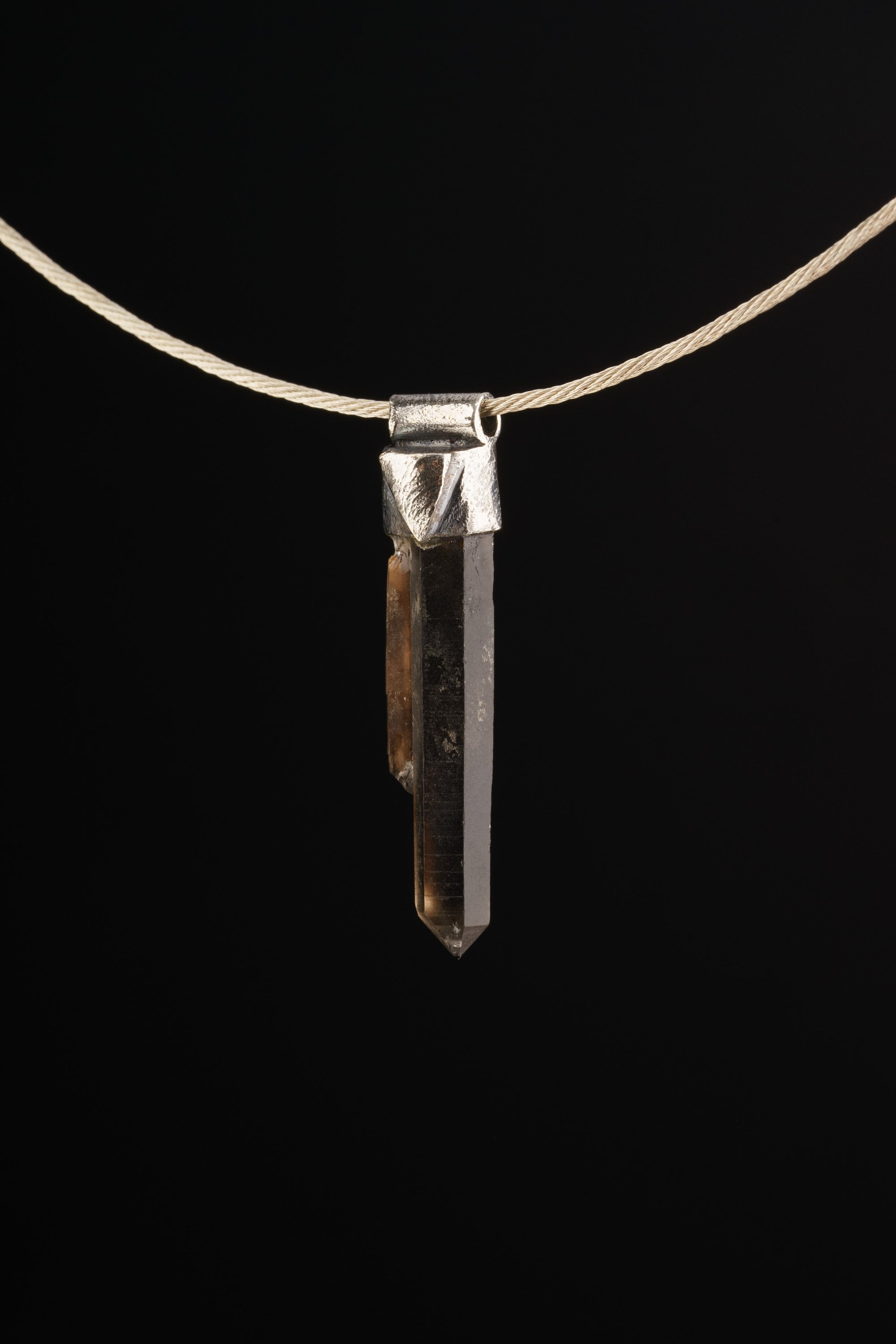Australian Twin Smoky Citrine Phantom Stack Pendant shown on black background with silver choker and slim crystal body.