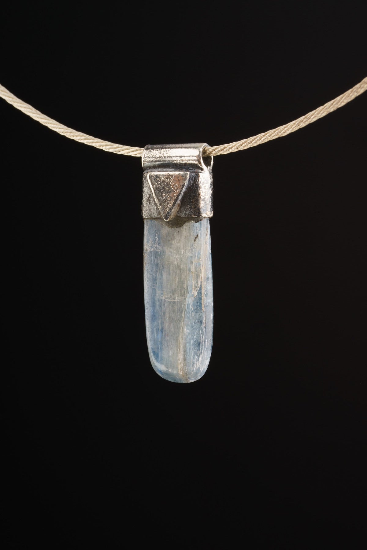 Australian Ocean Kyanite Stack Pendant shown worn on the choker with sterling silver cap and polished blue-green crystal.