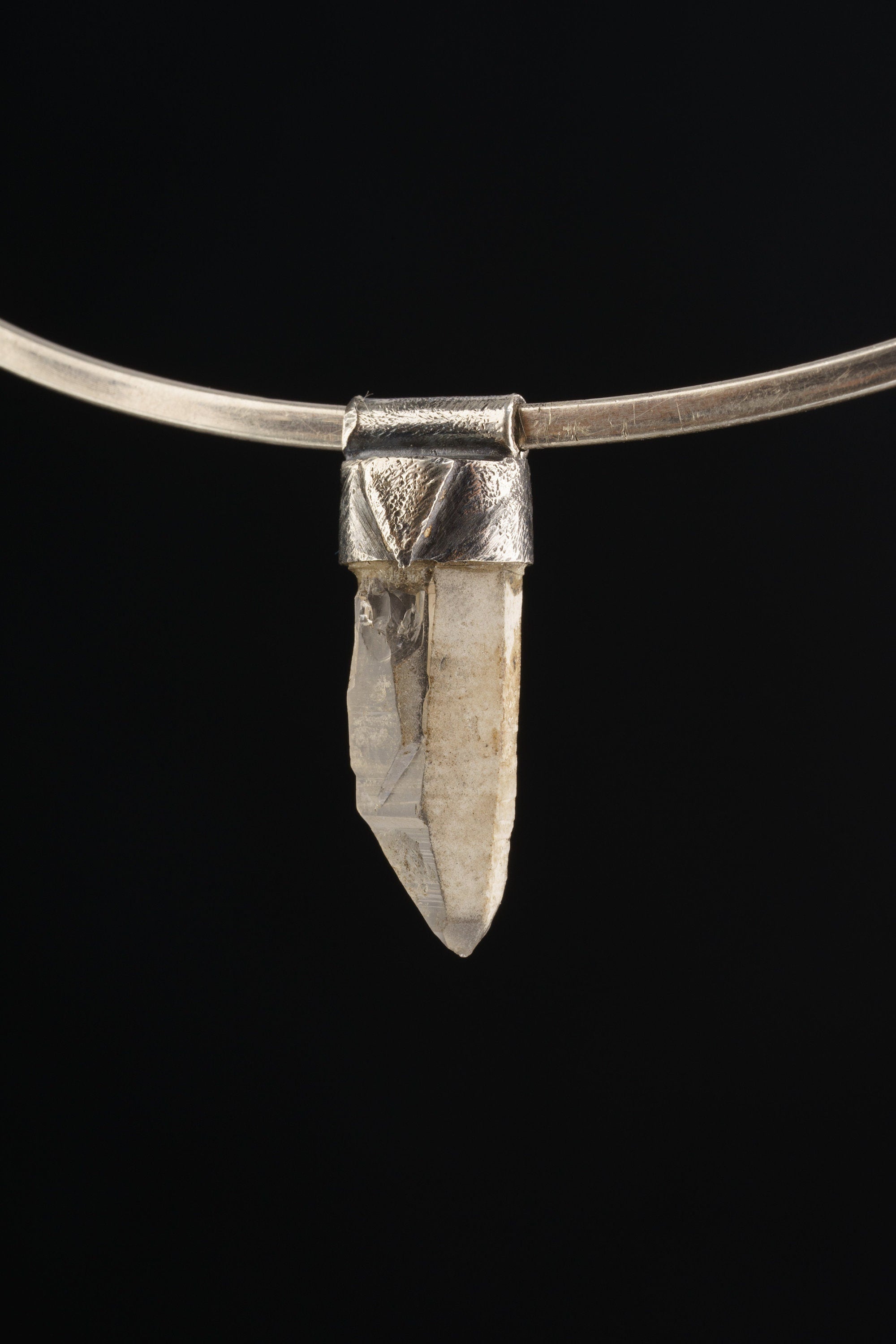 Australian Lithium Quartz Stack Pendant shown on black background with sterling silver cap and clear crystal body.