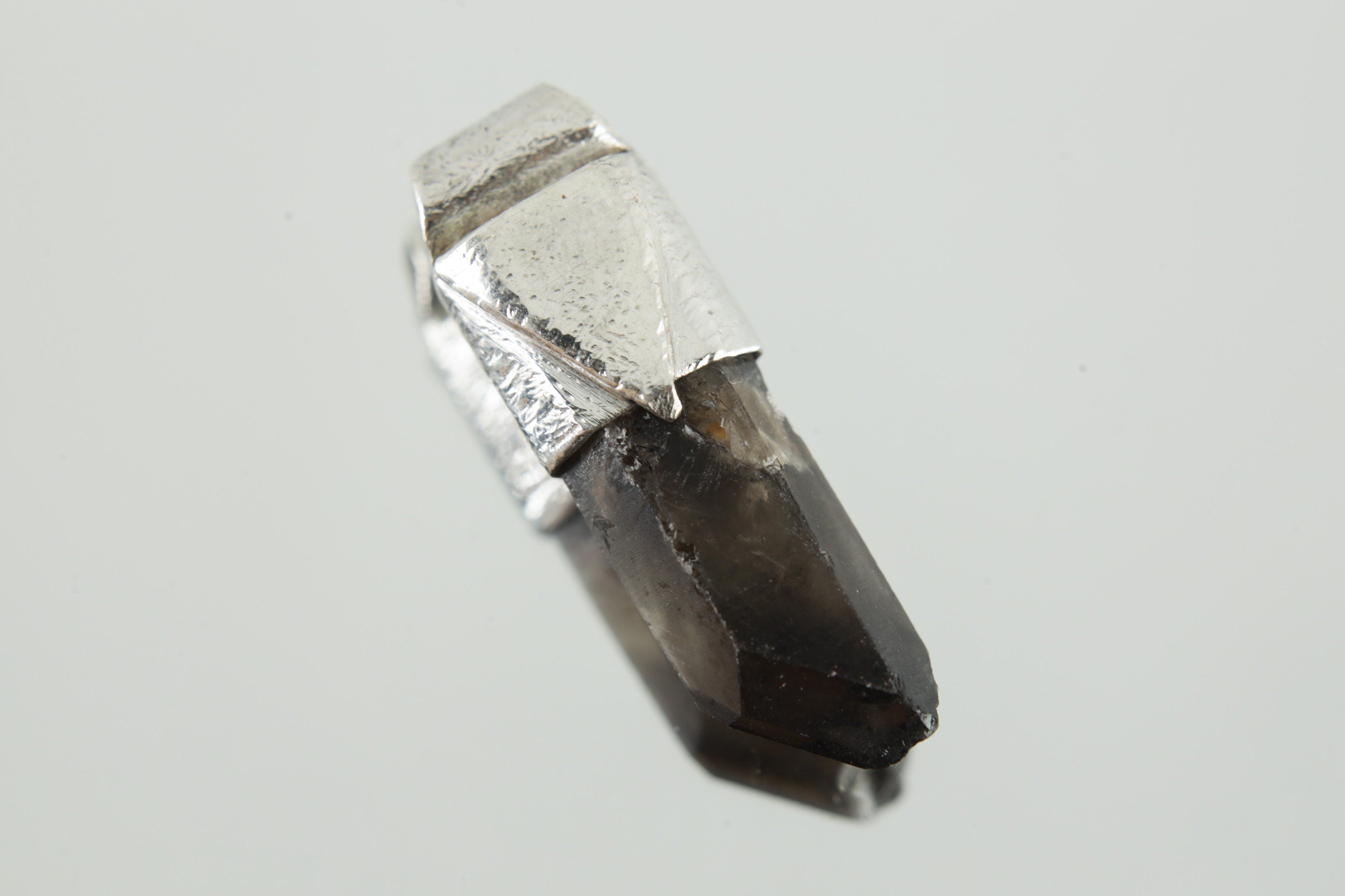 Australian Smoky Phantom Window Quartz Stack Pendant shown on light background with smoky translucent crystal and silver cap.