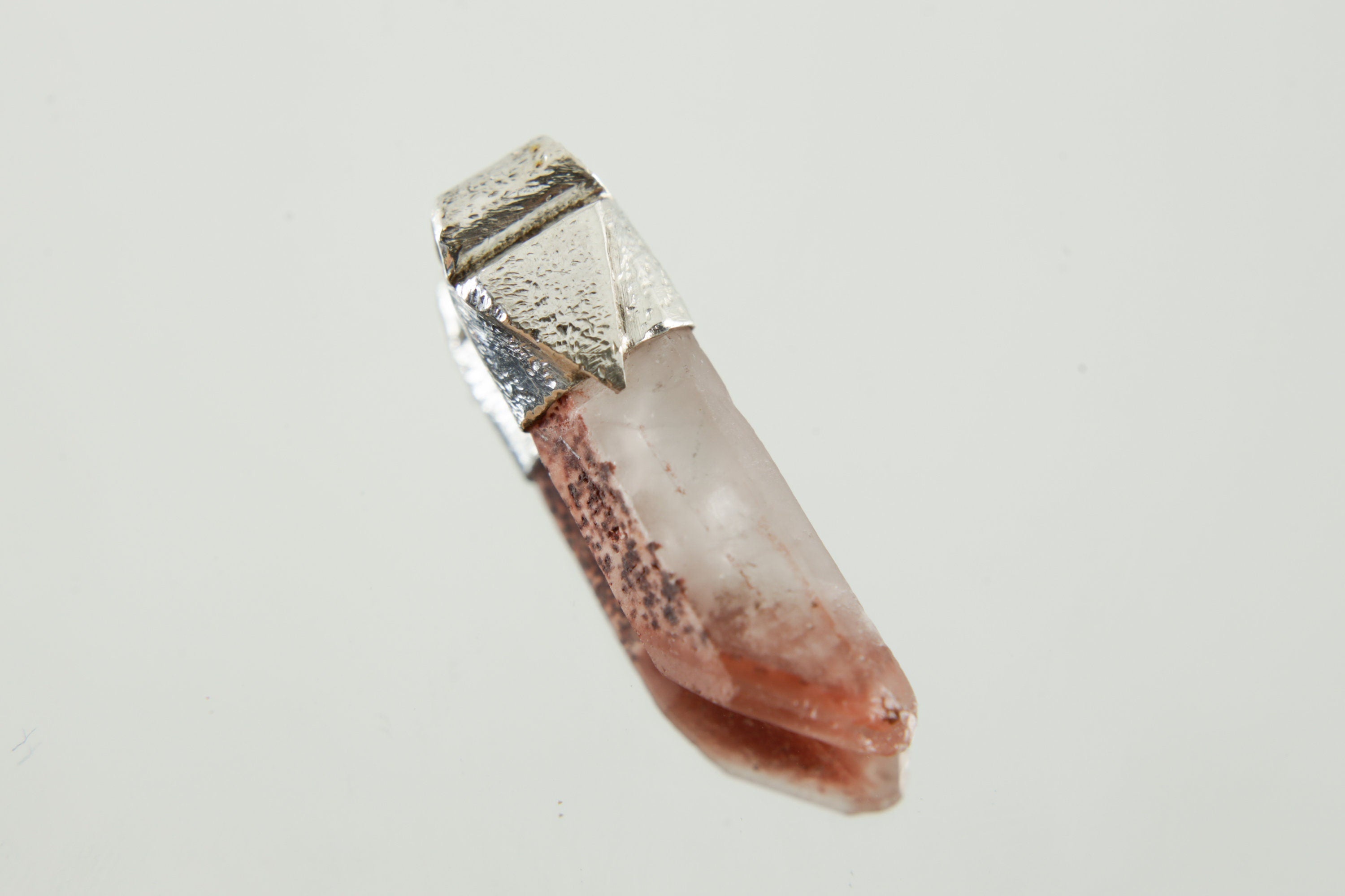 Australian Phantom Lithium Quartz Stack Pendant shown on light background with visible internal phantom layers and textured silver cap.