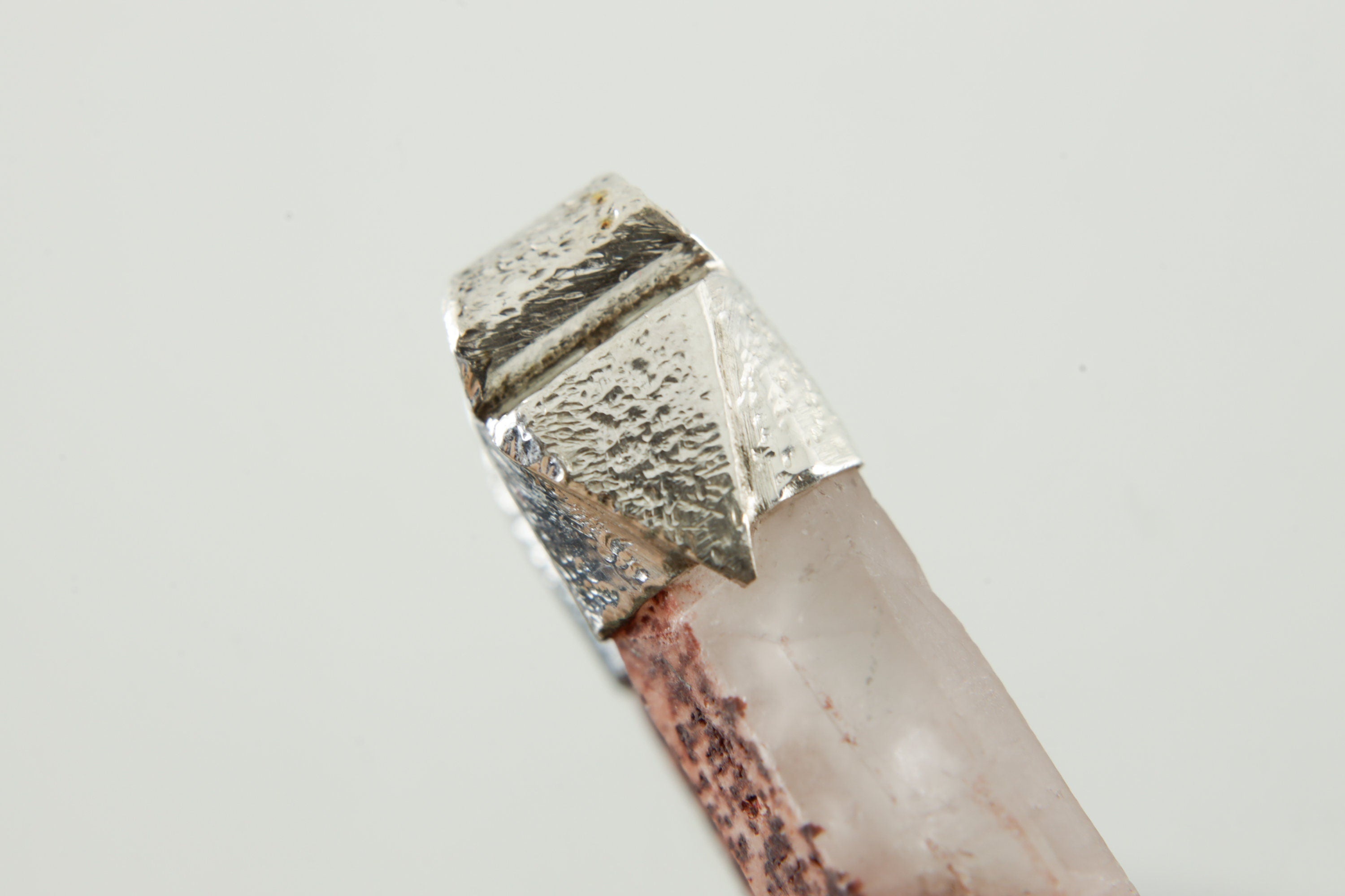 Close-up of Australian Phantom Lithium Quartz in a handmade sterling silver Stack Pendant cap with signature triangle detail.