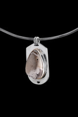 Fossilized Crystal Drusy Shell pendant displayed on choker against black background with dual bail design.
