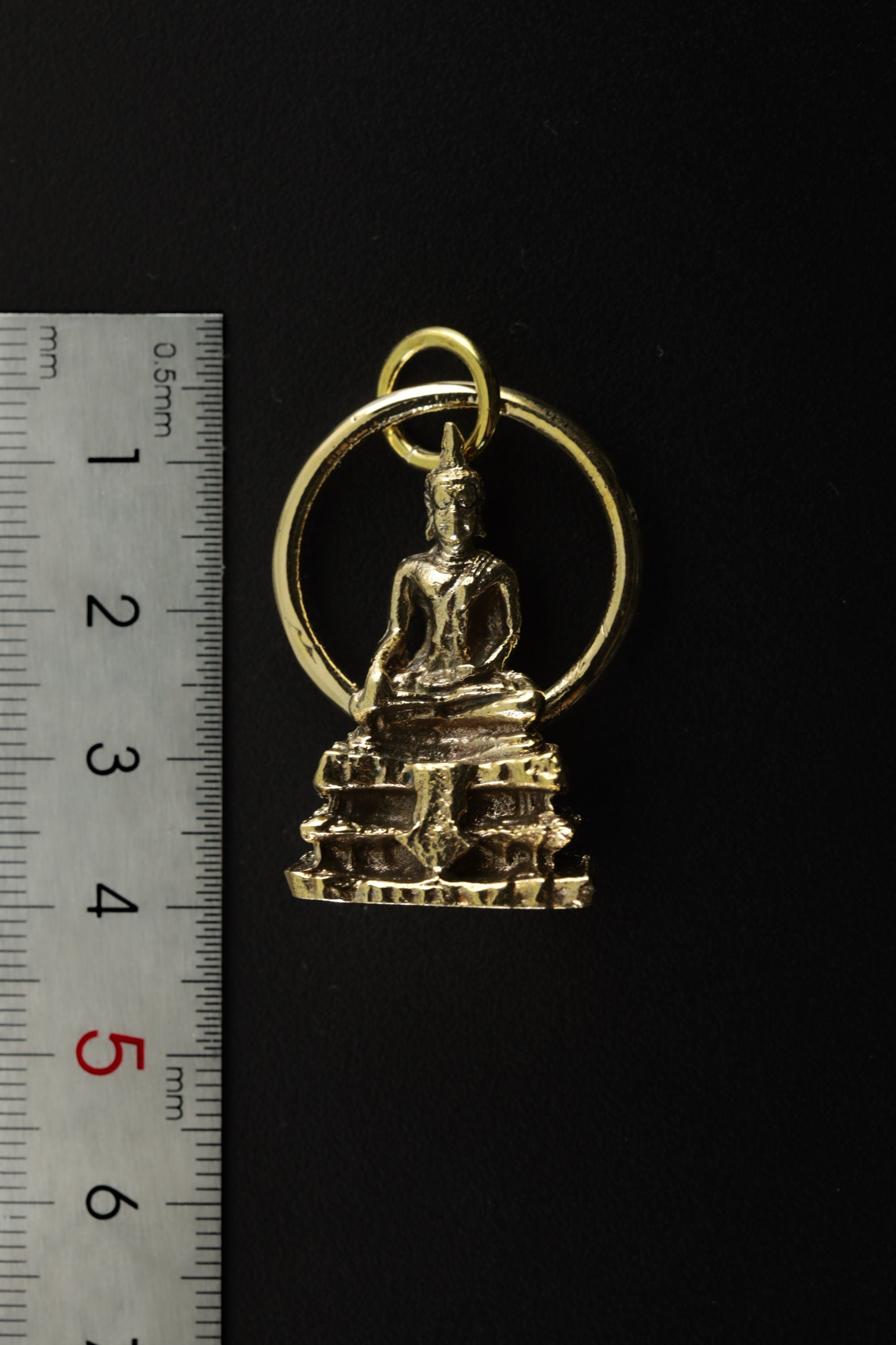 Gold-plated brass Bodhi pendant shown beside a ruler for scale, with sacred tree-inspired spiritual design.