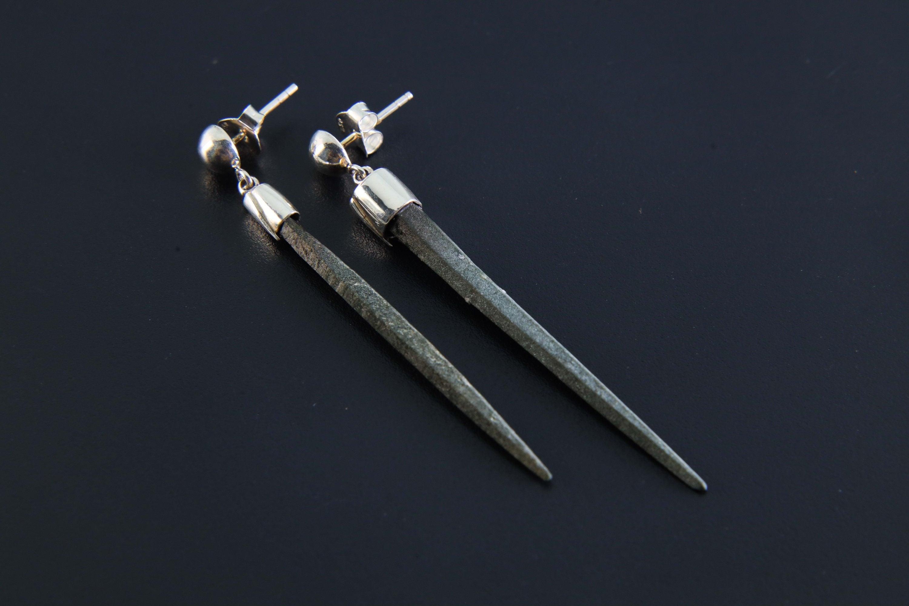 Rare Spiky Himalayan Chlorite Quartz earrings shown on dark background, with long raw crystal points and polished silver studs.