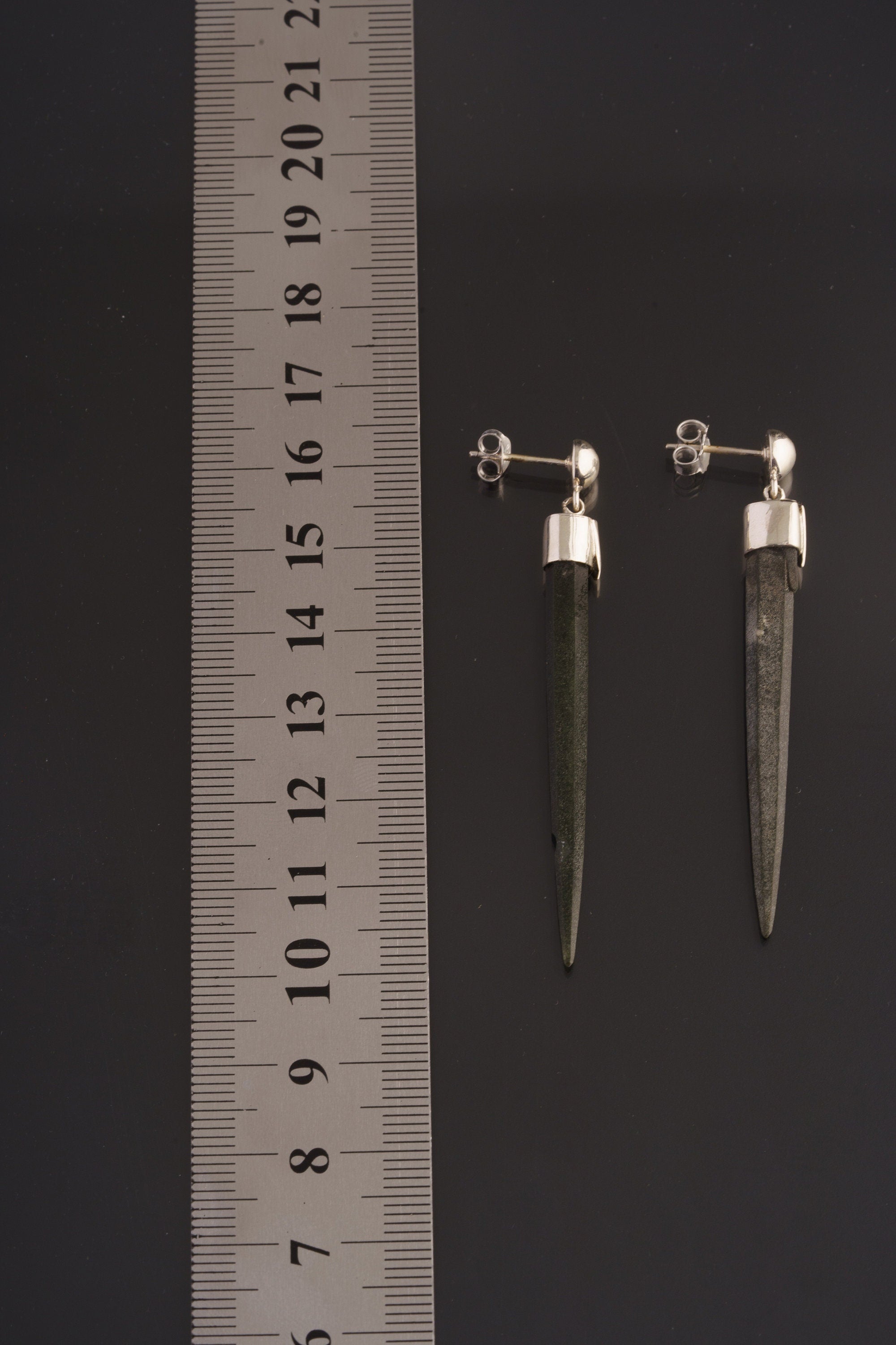 Himalayan Chlorite Icicle Quartz earrings shown beside a ruler for length reference, with sterling silver posts and backs.