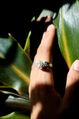 Cacoxenite Quartz point ring shown worn on the hand, with golden-brown inclusions and shiny hammered sterling silver band.