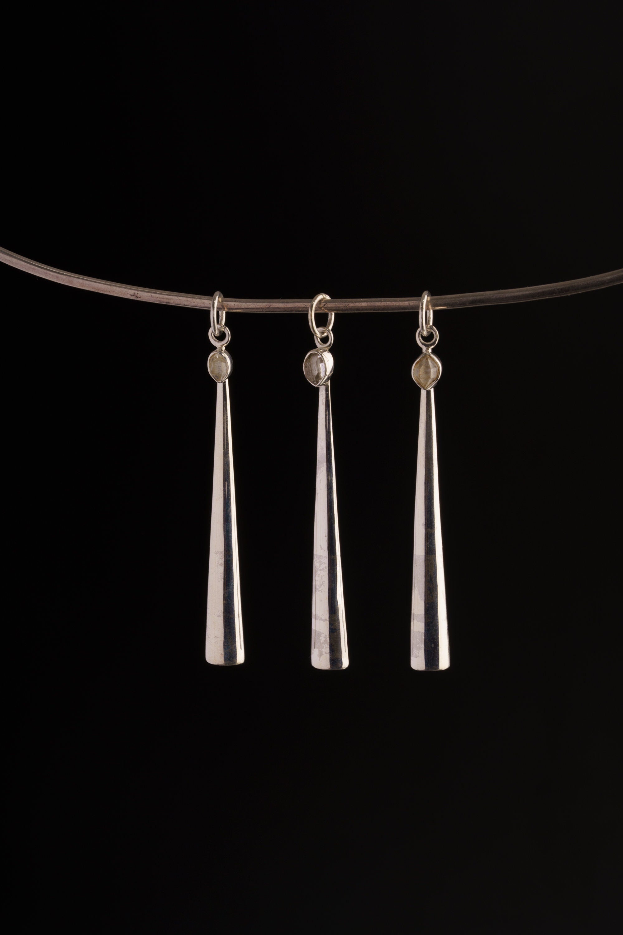Herkimer Diamond spoon pendant displayed on a choker, showing slim silver ritual scoop styling.