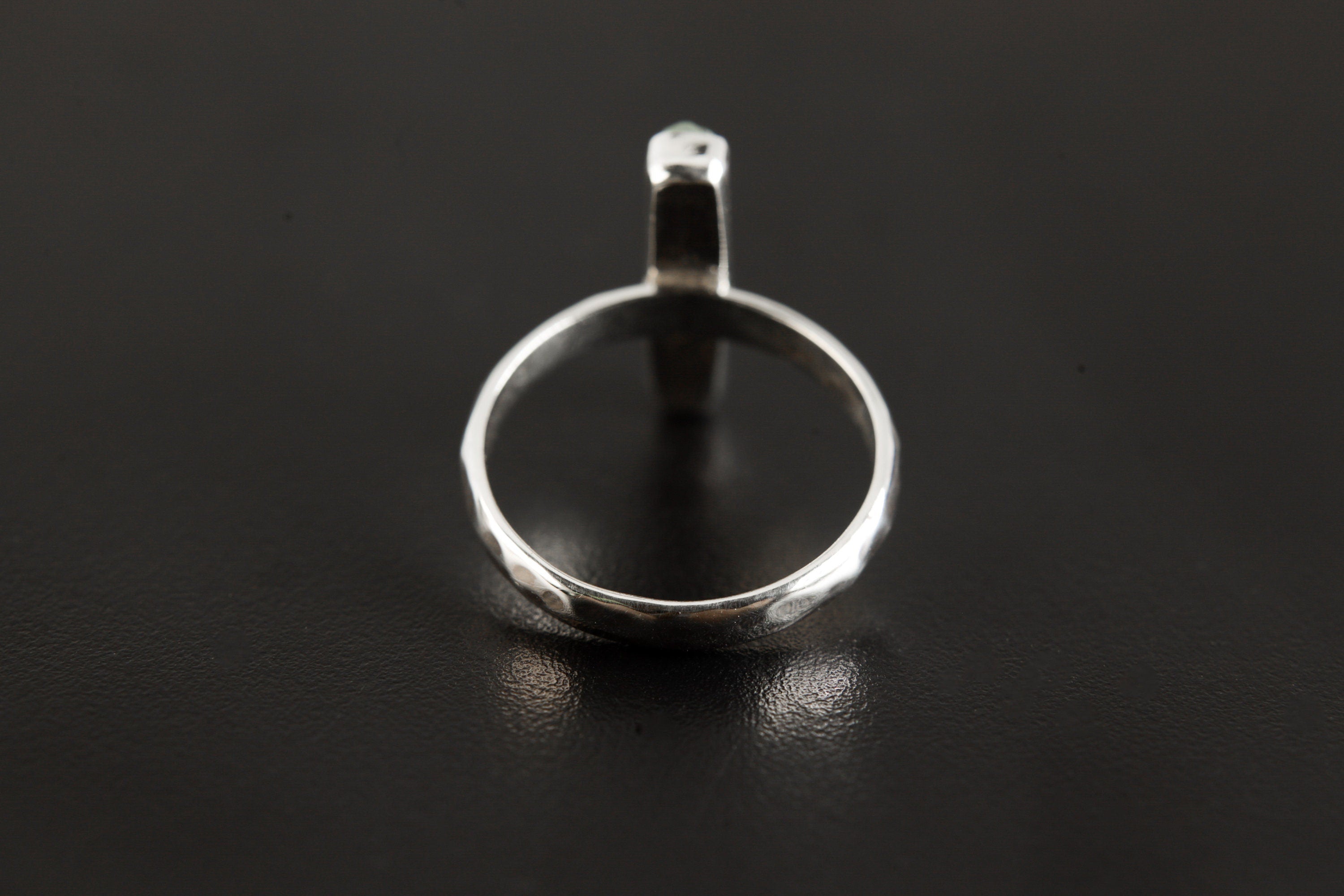 Back view of Aquamarine silver ring showing polished hammered band and handmade sterling silver profile.