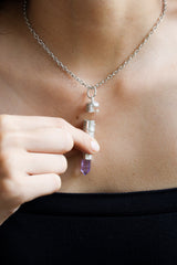 Vera Cruz Amethyst keepsake pendant worn as a spiritual crystal necklace.