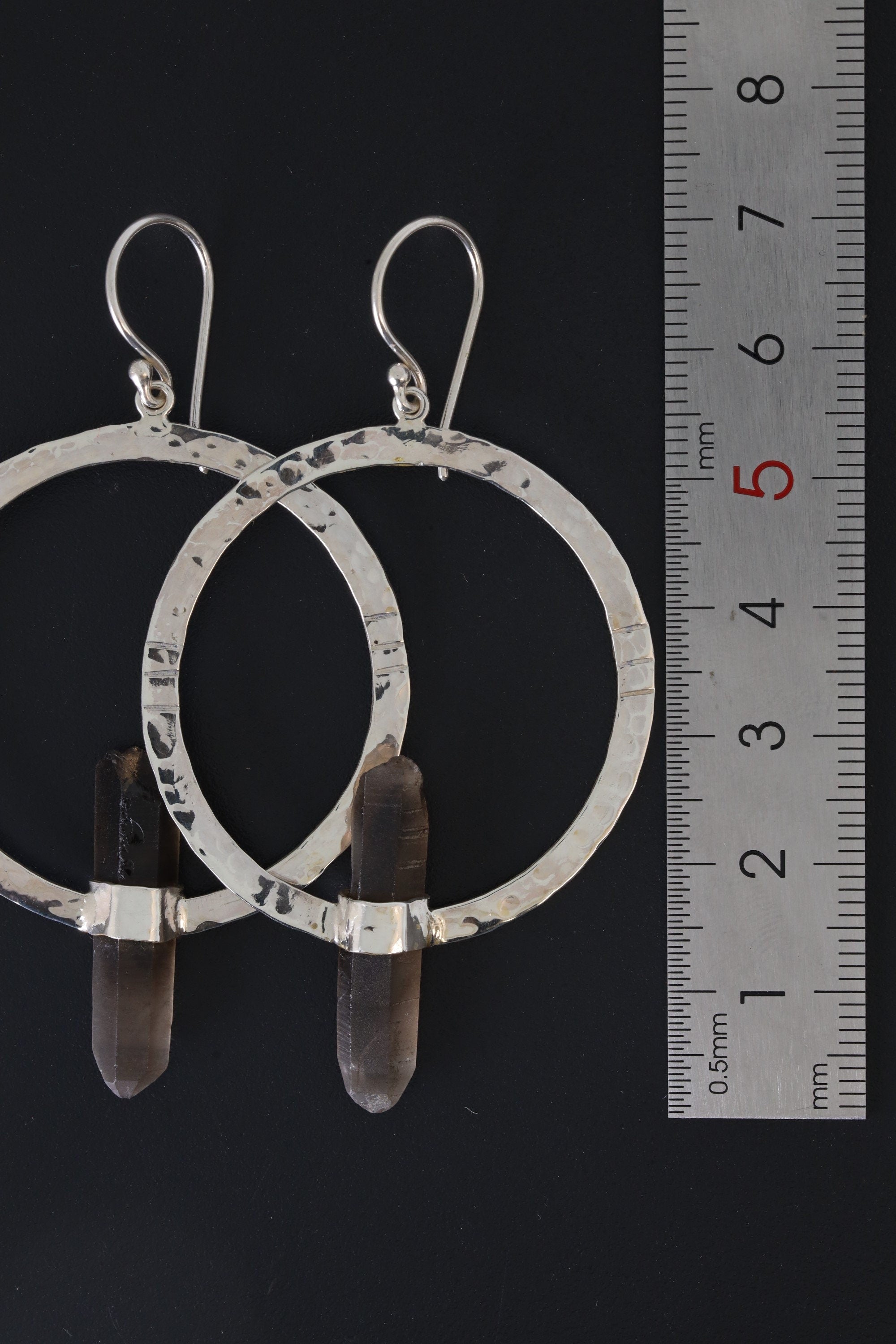 Australian Smoky Quartz hoop earrings shown beside a ruler for scale, with hammered sterling silver portal frames.