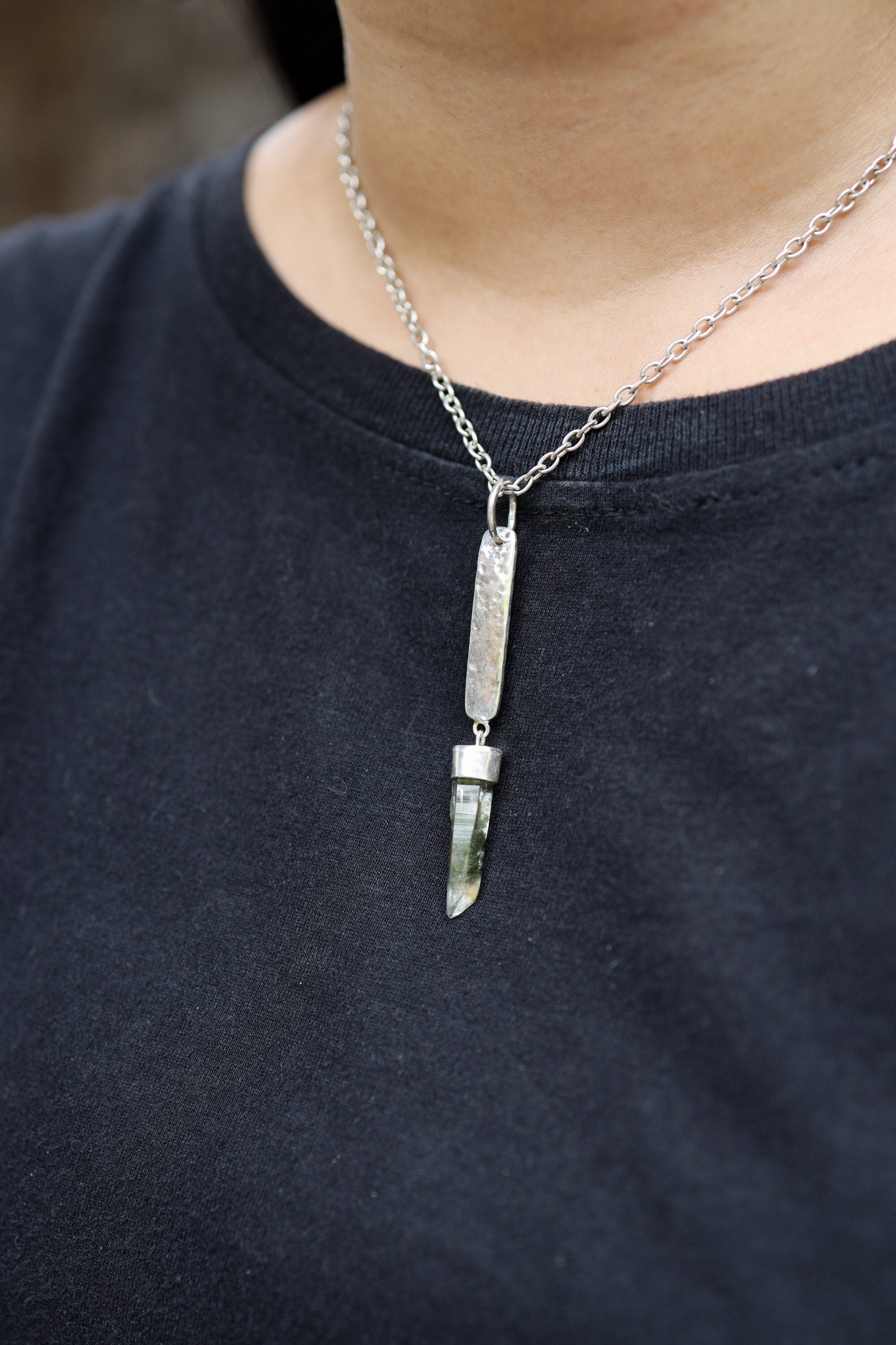 Himalayan Chlorite Quartz sterling silver pendant worn on a model with hammered rectangular silver detail.