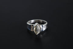 Crystal Clarity Herkimer Diamond Ring shown on black background with hammered sterling silver and clear crystal focal point.
