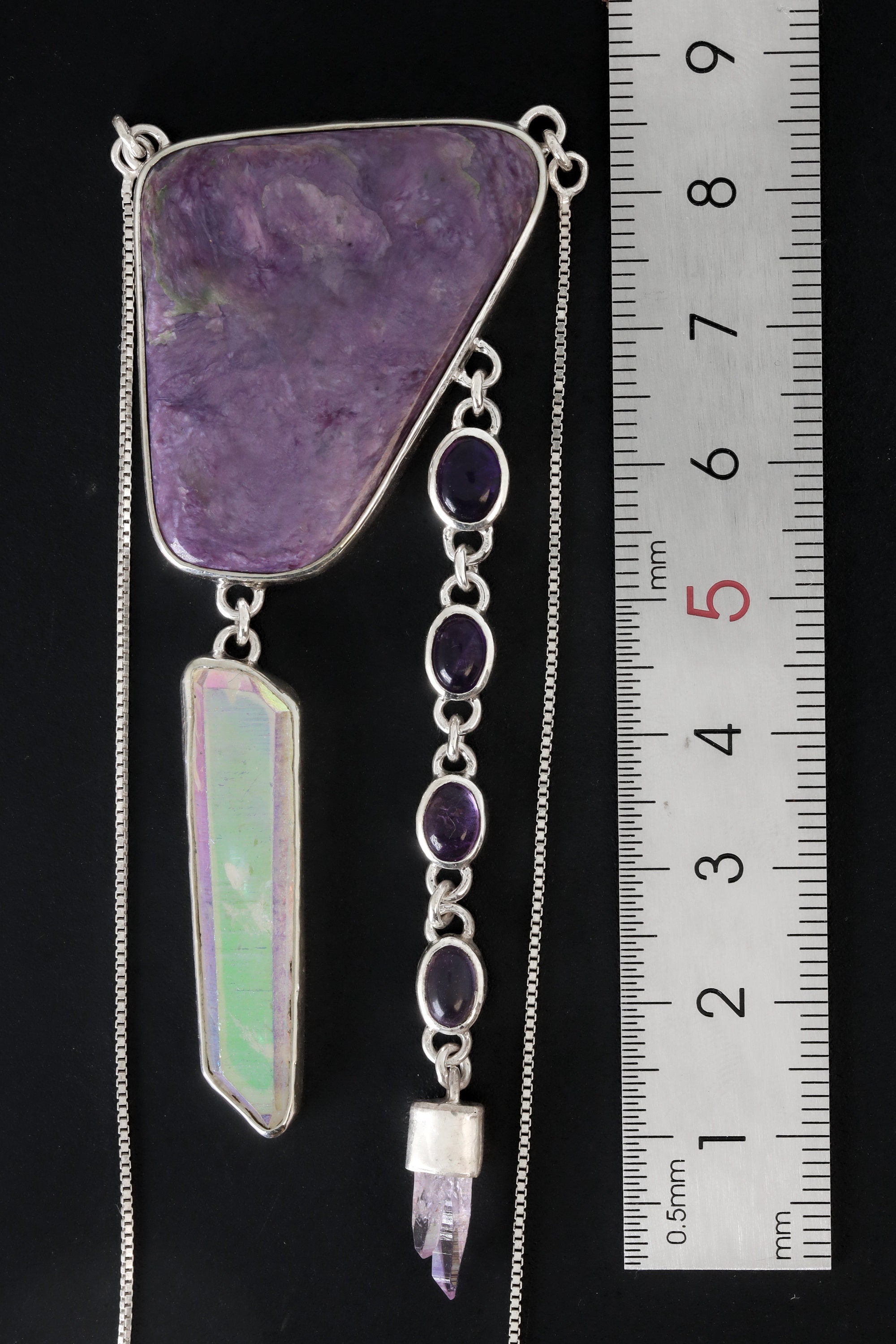 Charoite Angel Aura Quartz Amethyst pendant shown beside a ruler for scale, with linked violet crystal layout.