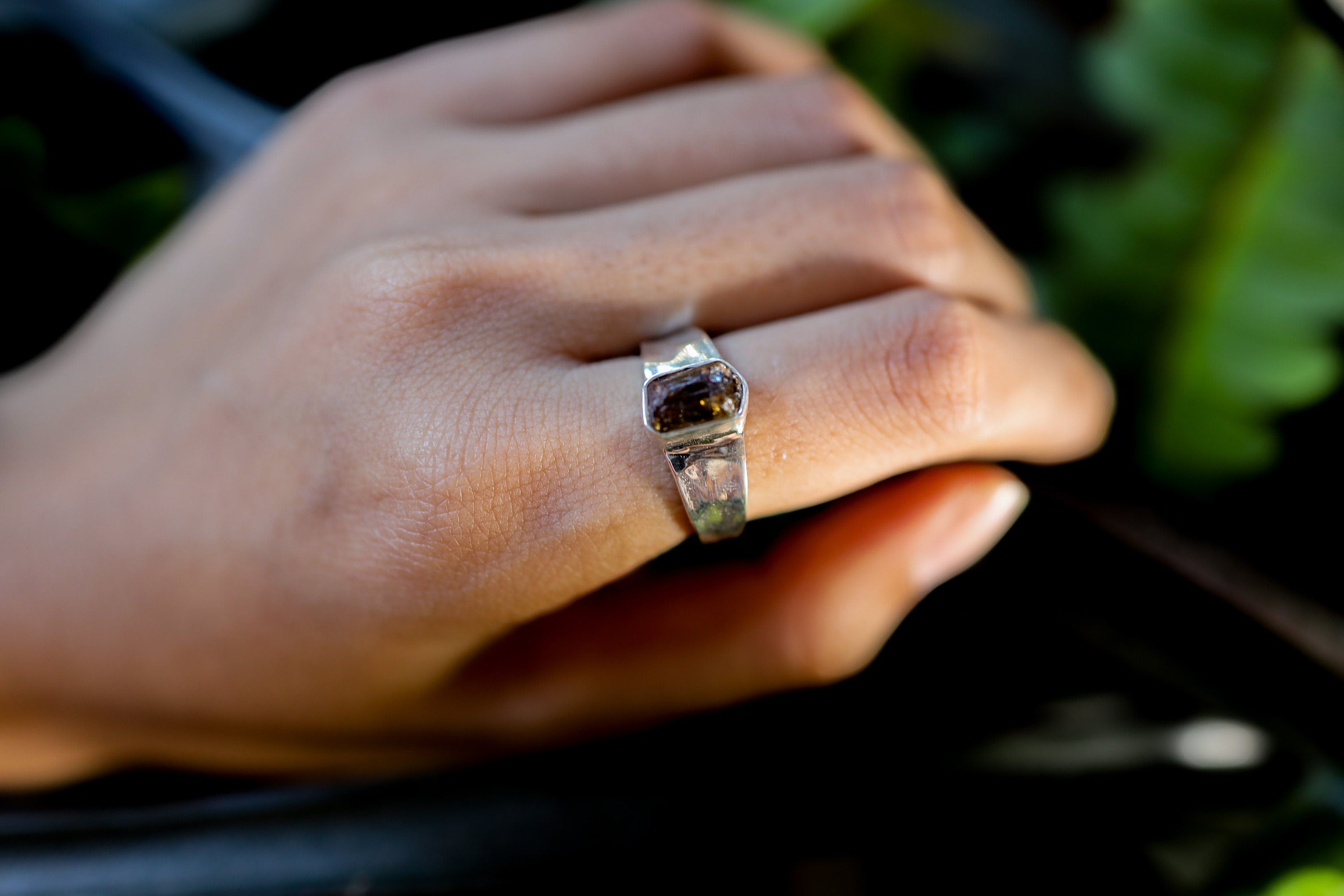 Brown Tourmaline Terminated Ring shown worn outdoors with earthy brown crystal and hammered 925 silver texture.