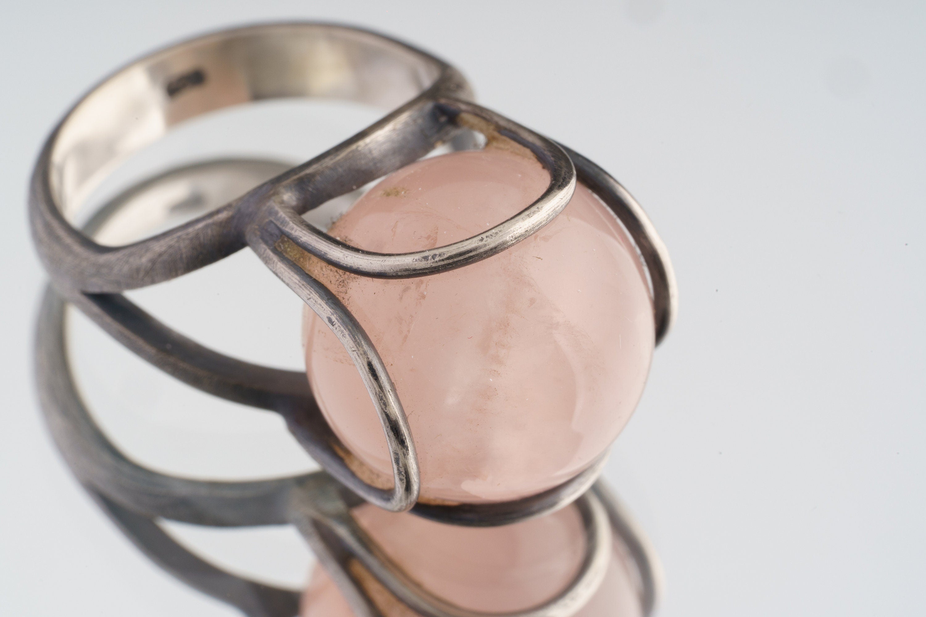 Close-up of Rose Quartz Floral Silver Ring showing organic silver wire petals around the soft pink cabochon.