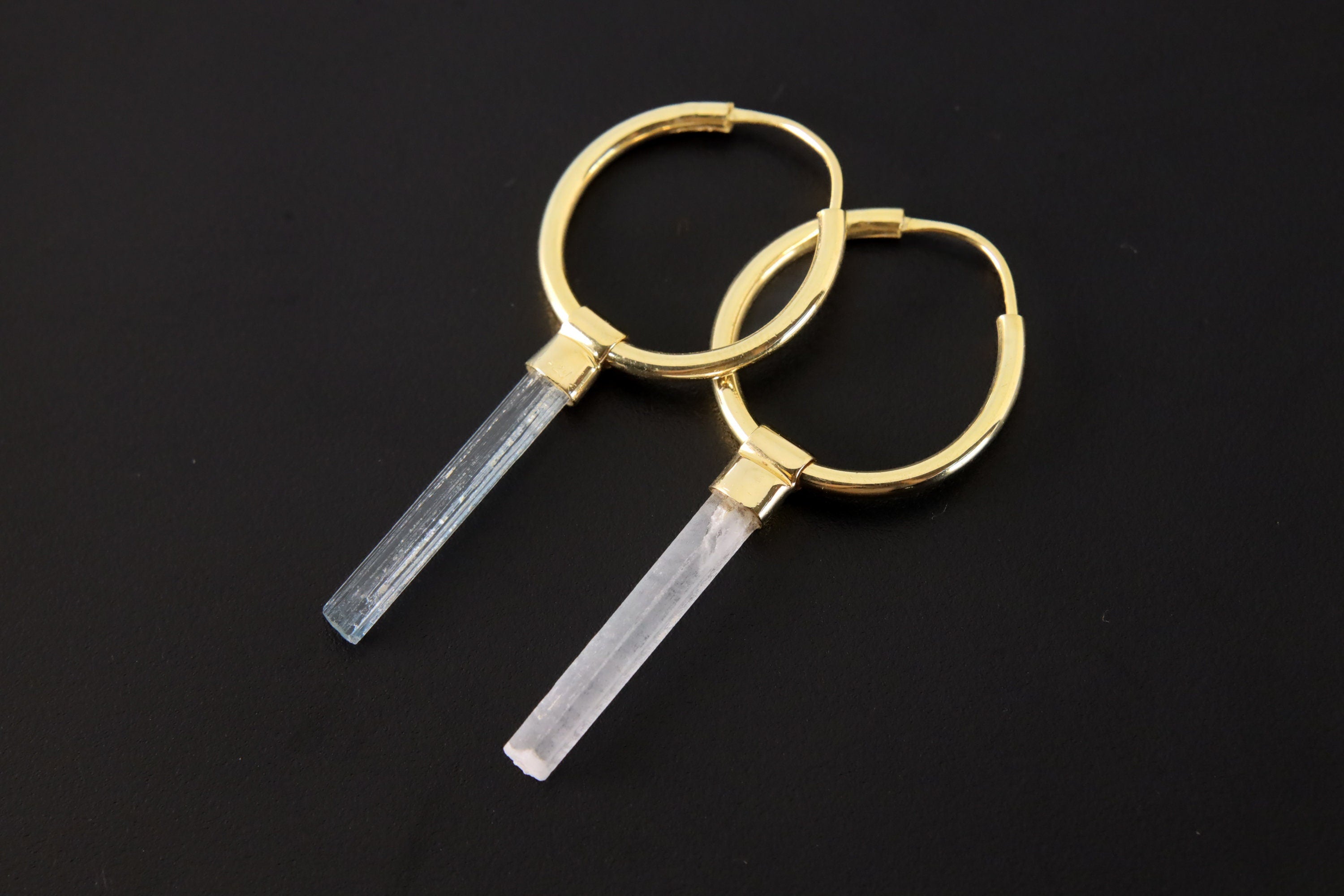 Gold-plated Aquamarine hoop earrings shown on a dark background, with natural Australian crystal drops and circular hoops.