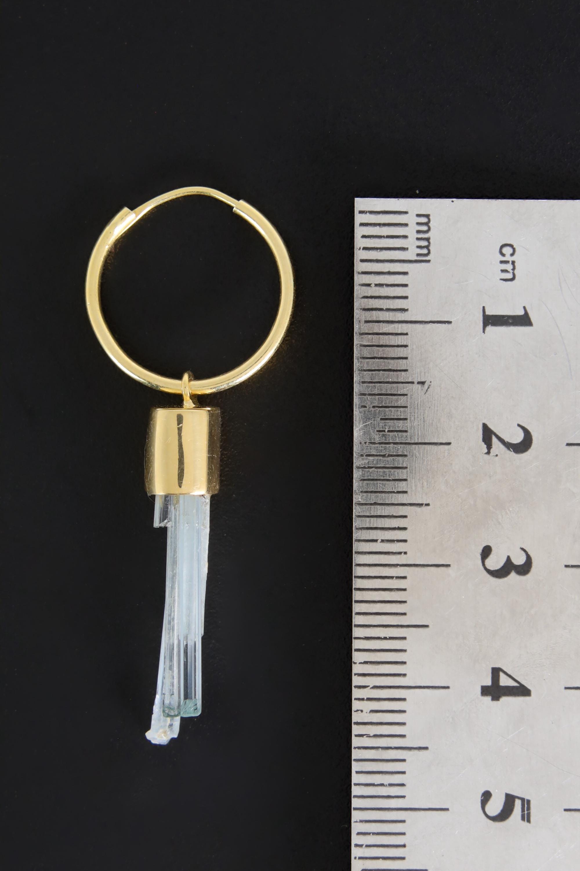 Aquamarine gold-plated hoop earring pendant shown beside a ruler for scale as one single convertible piece.