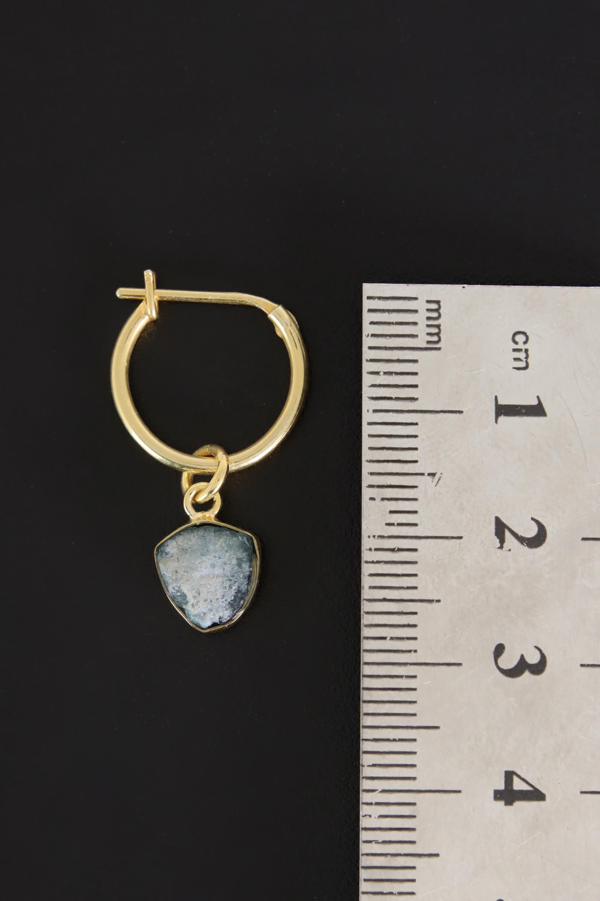 Blue Tourmaline convertible hoop earring shown beside a ruler for scale, with gold-plated silver and raw gemstone drop.